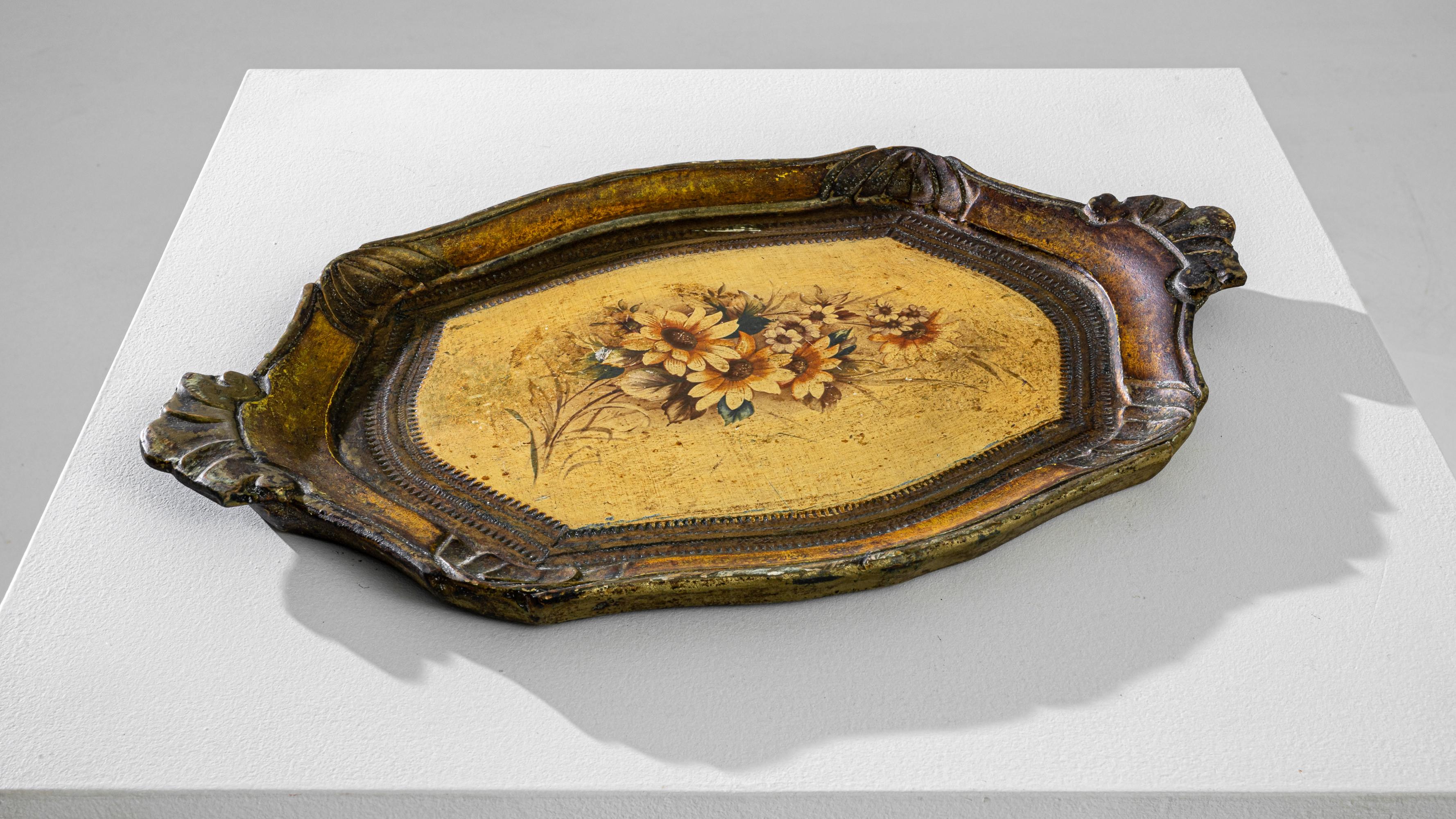 An elegant vintage tray hand-crafted in Italy circa 1960. Tempered by the ages of family dinner presentations, rich texture and color meet at this miniature table. A seductive outline is sculpted by its carved edges and enriched by the gilded