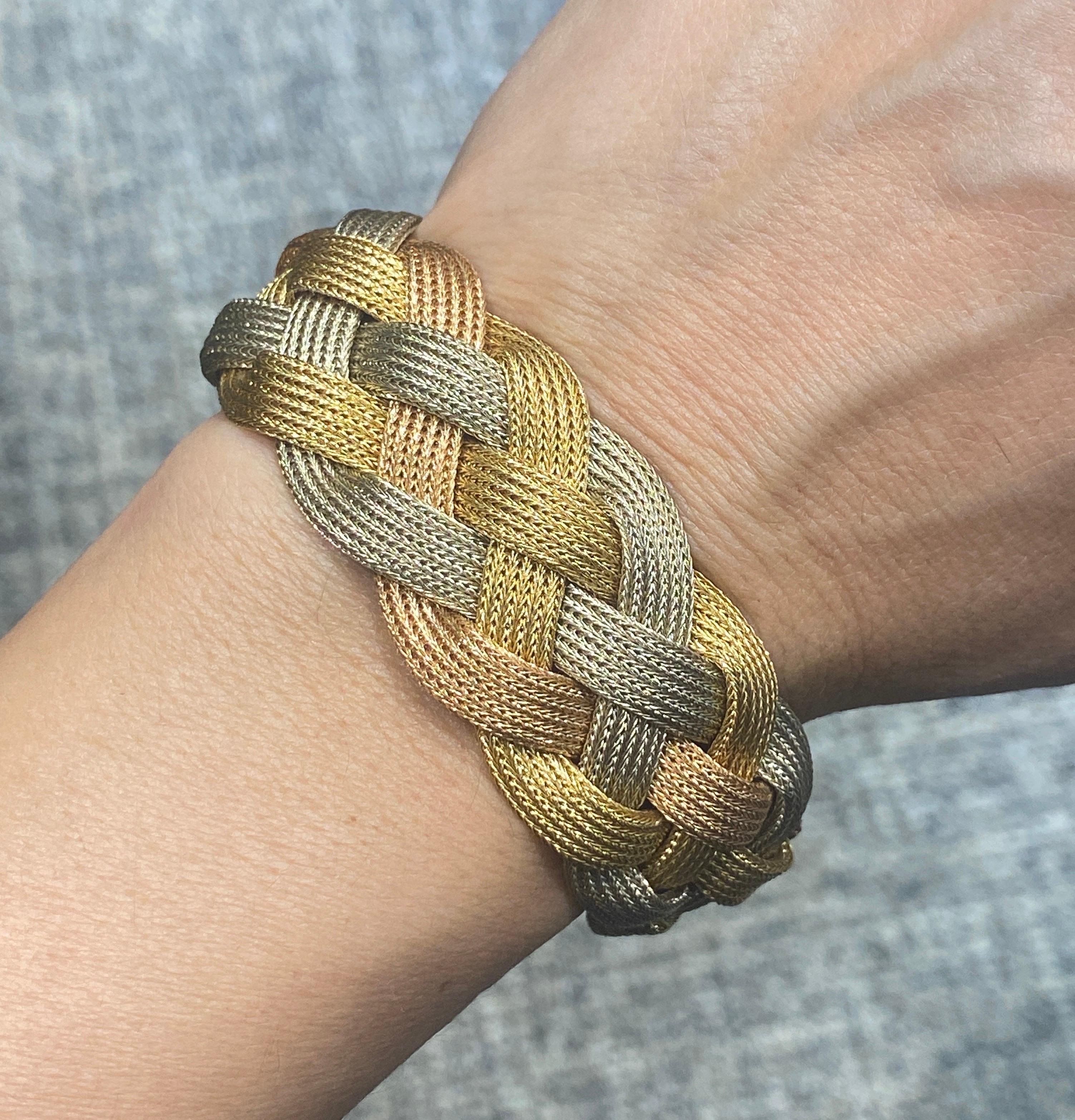 This beautiful 18 carat gold 1960s Italian plaited bracelet is made of white, yellow and rose gold. Although a large piece it is very comfortable to wear and is a stylish addition to any outfit.

The bracelet carries an Italian maker's mark.
