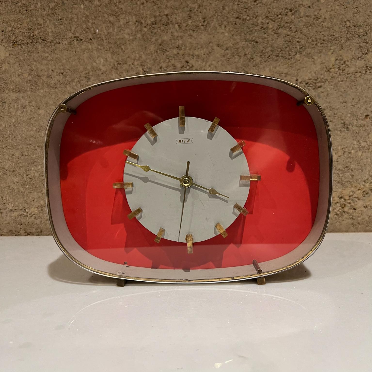 Art Deco fabulous pink vintage table clock by RITZ made in ITALY 1960s
Mechanical Wind-up Alarm Desk Clock
Colors of Pink Salmon, White, Black, & Gold in Brass and Lucite Plexiglass.
Time markers have Lucite trim.
Table Clock legs are in solid