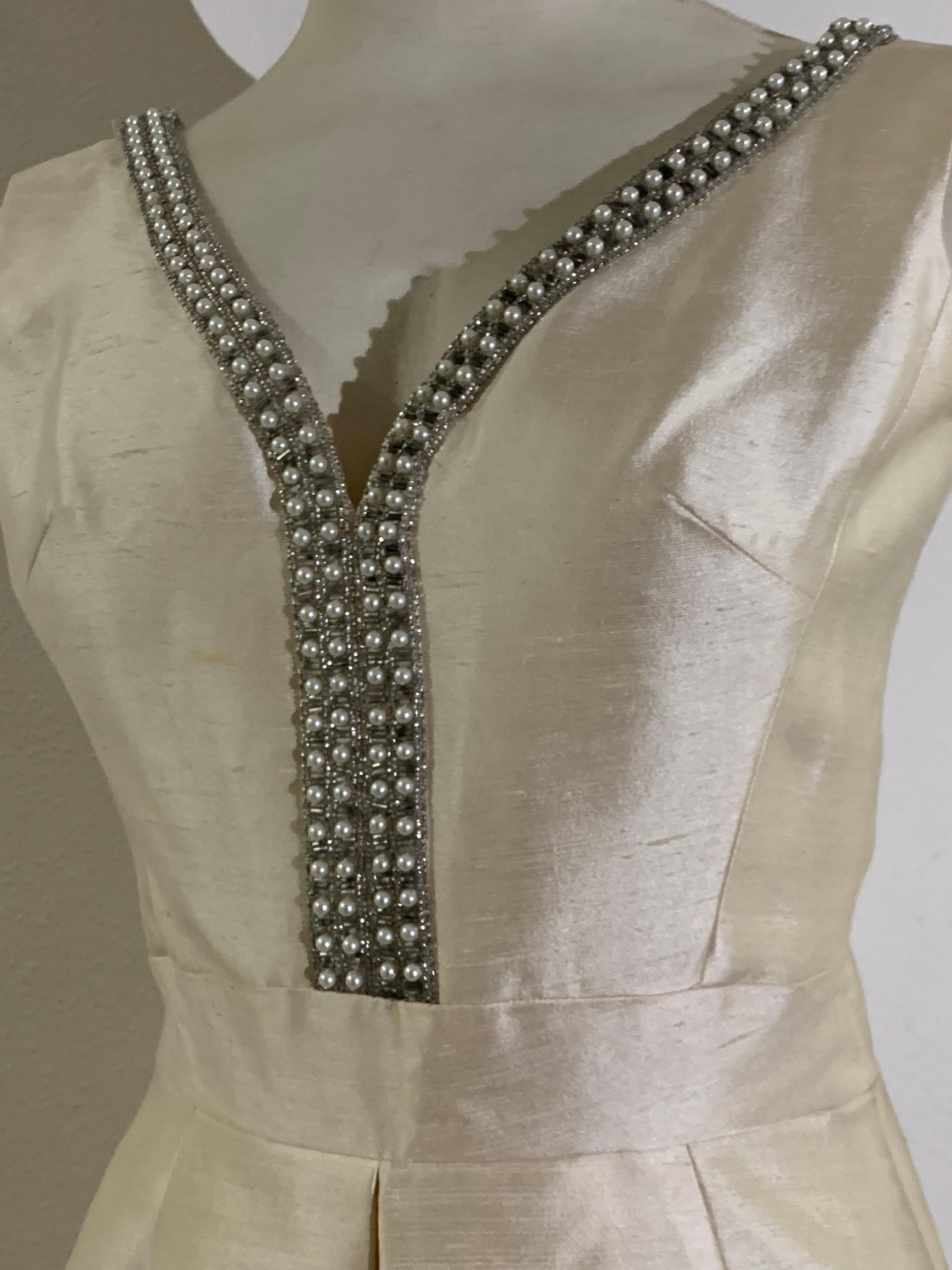 1960s Ivory Shantung Silk Mini Dress w Rhinestone Décolletage and A-Line Skirt: From Engelman's, this lady-like princess-cut bodice is edged in bead, pearl and rhinestone piping down front as well as the low-cut back. Banded waist. Skirt is deeply