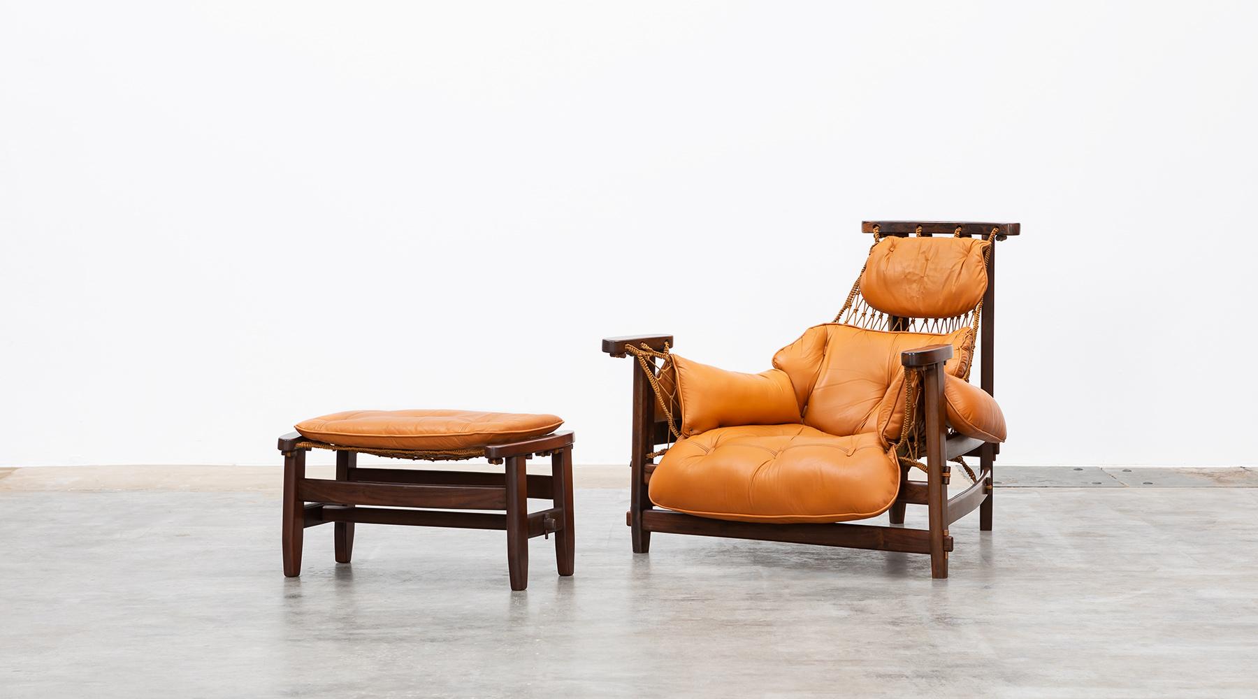 Captain´s chair, wood, leather, lounge chair with ottoman by Jean Gillon, Brazil, 1960.

Attached to the distinctive trapezoidal base form of Brazilian wood is a fishing net-like nylon mesh that supports the leather cushions. The so-called Captain's