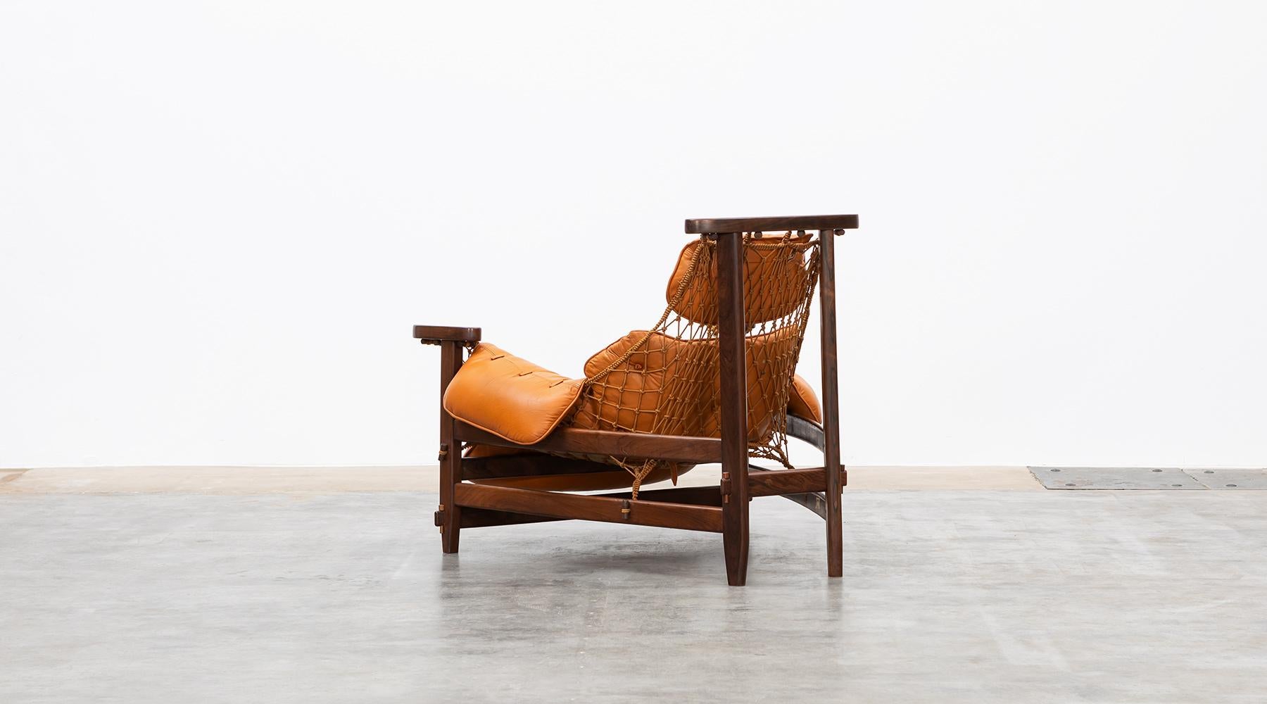 Mid-20th Century 1960s wood, leather cushion Lounge Chair and Ottoman by Jean Gillon