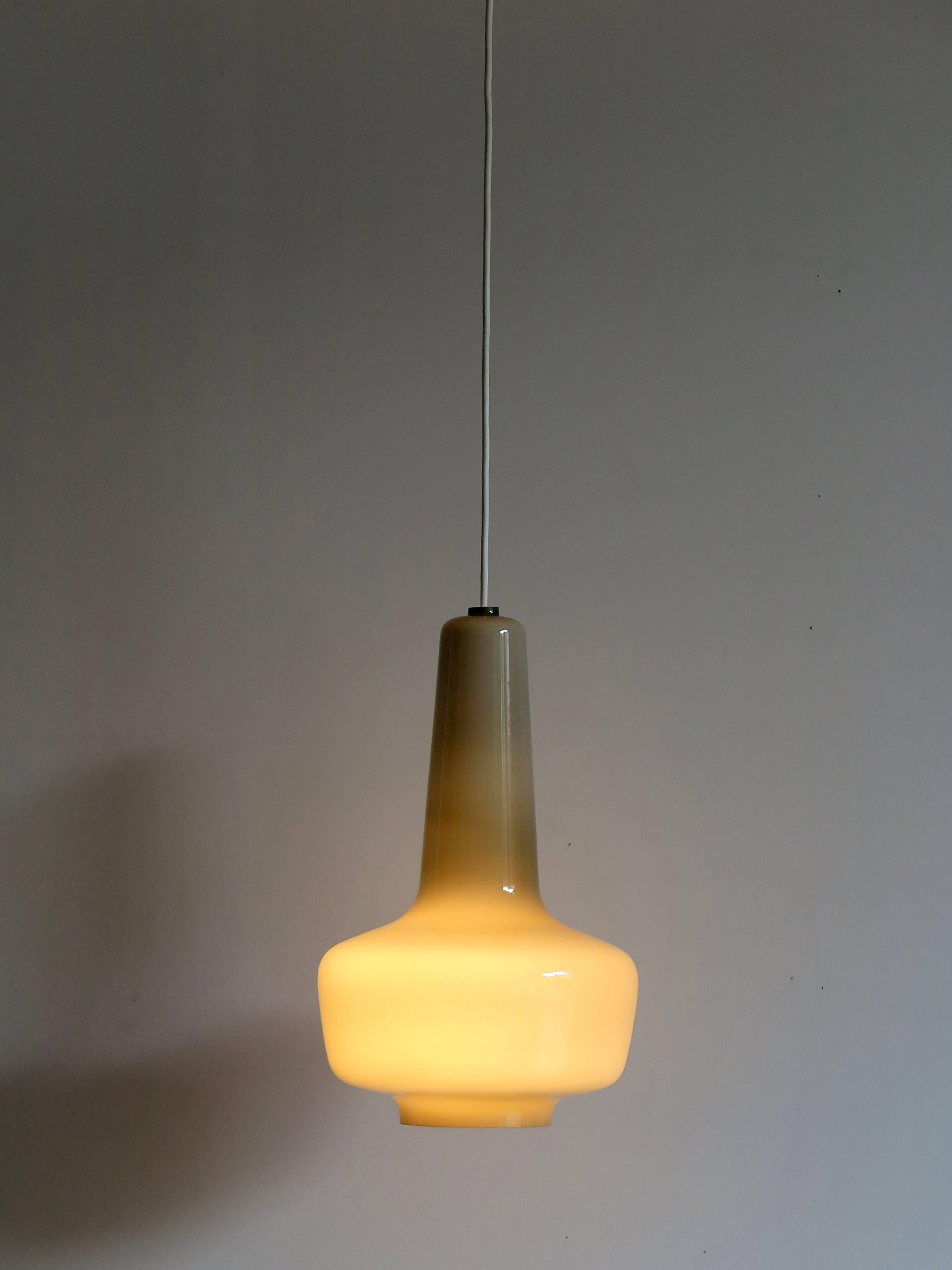 Kreta midcentury Scandinavian and Danish pendant lamp designed by Jacob Eiler Bang and manufactured by Fog and Mørup in 1965, it is made from grey opal glass in a funnel shape.