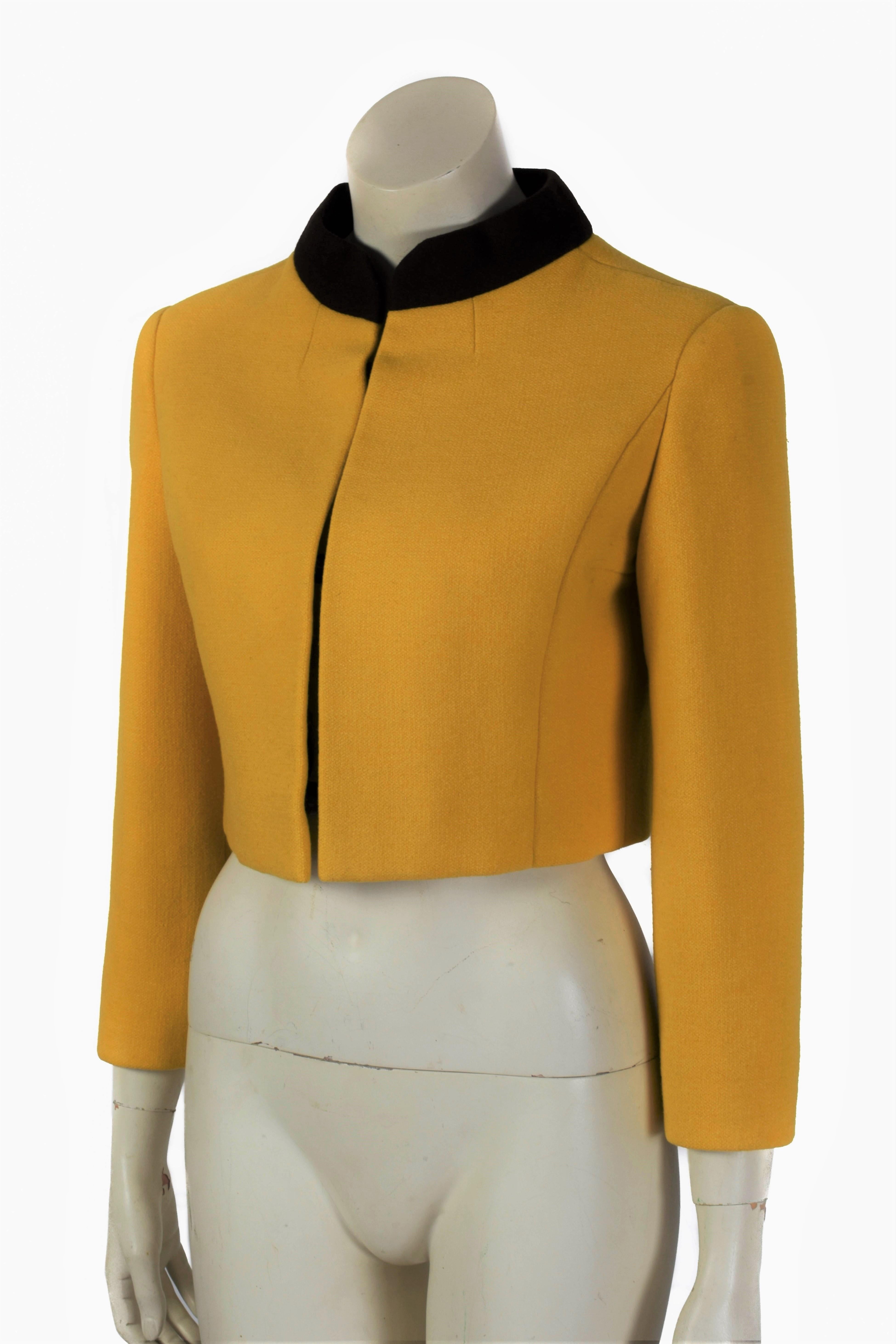 This 1960's jacket by Jacques Heim is a lovely Haute Couture piece in a deep shade of yellow. It is a cropped model which accentuates the waist and has a hidden toggle closure.

Size: Appoximately S / US 6 / UK 8 / FR 38
Haute Couture Numbered