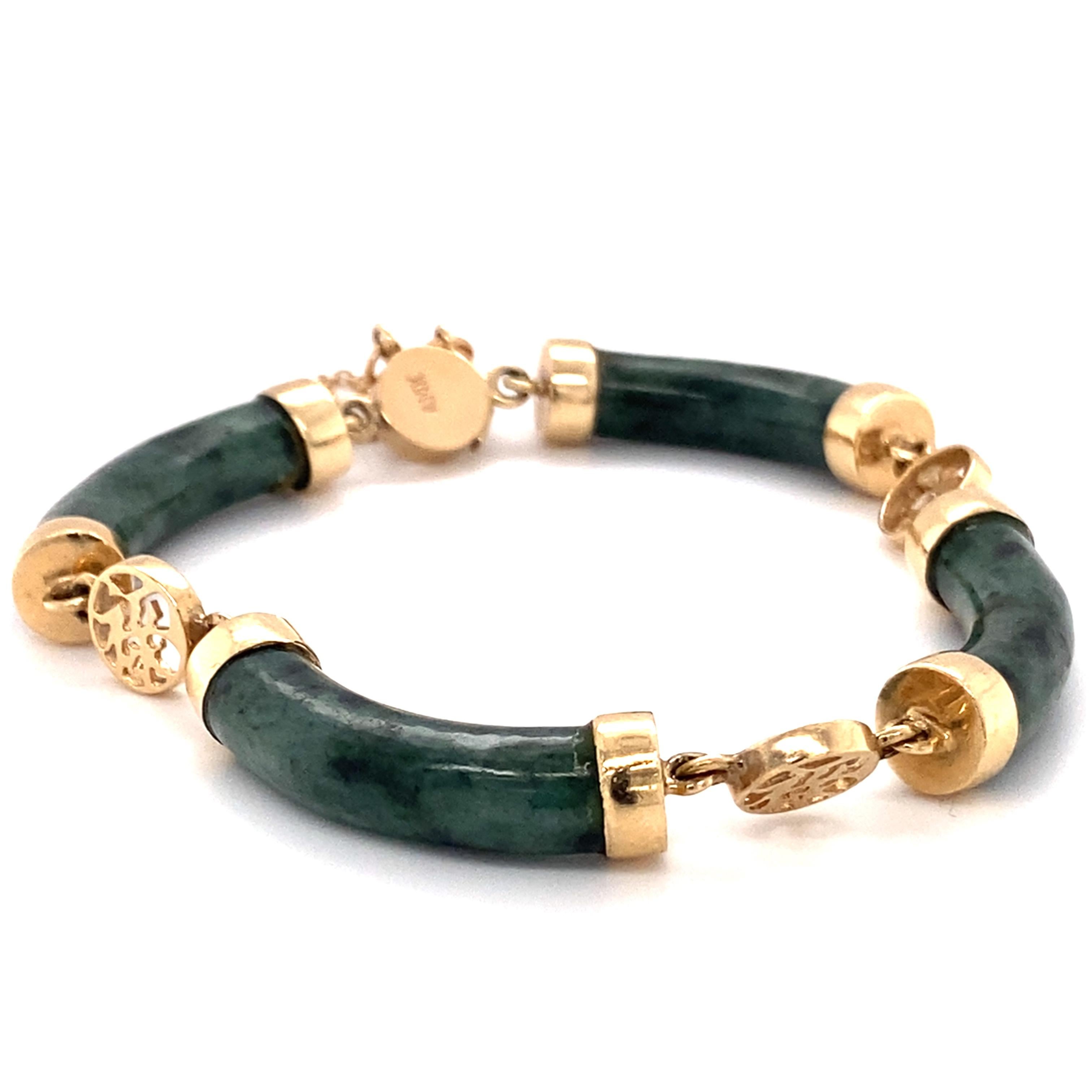 Item Features:
Gemstone: Jade
Metal: 14 Karat Yellow Gold
Weight: 22.2 grams
Measures: 7 inch Length

Item Details:
This beautiful bracelet made in 1960s features 4 carved pieces of green Jade segmented between 14 karat yellow gold charms with a