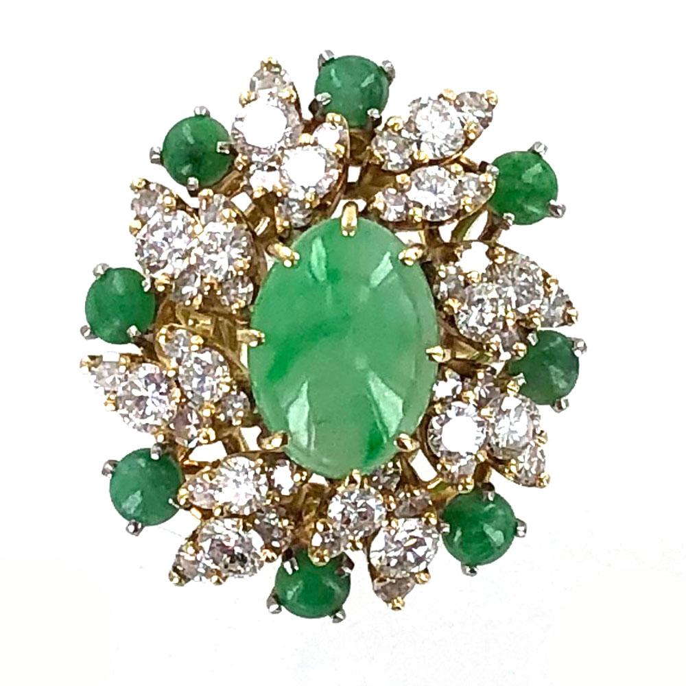 Jade and diamond cocktail ring circa  1960's. Fifty seven round brilliant cut diamonds (2.50 carat total weight) are set to look like marquise shapes. The diamonds are graded G-F color and VS clarity. A cabochon green jade gemstone is set in the