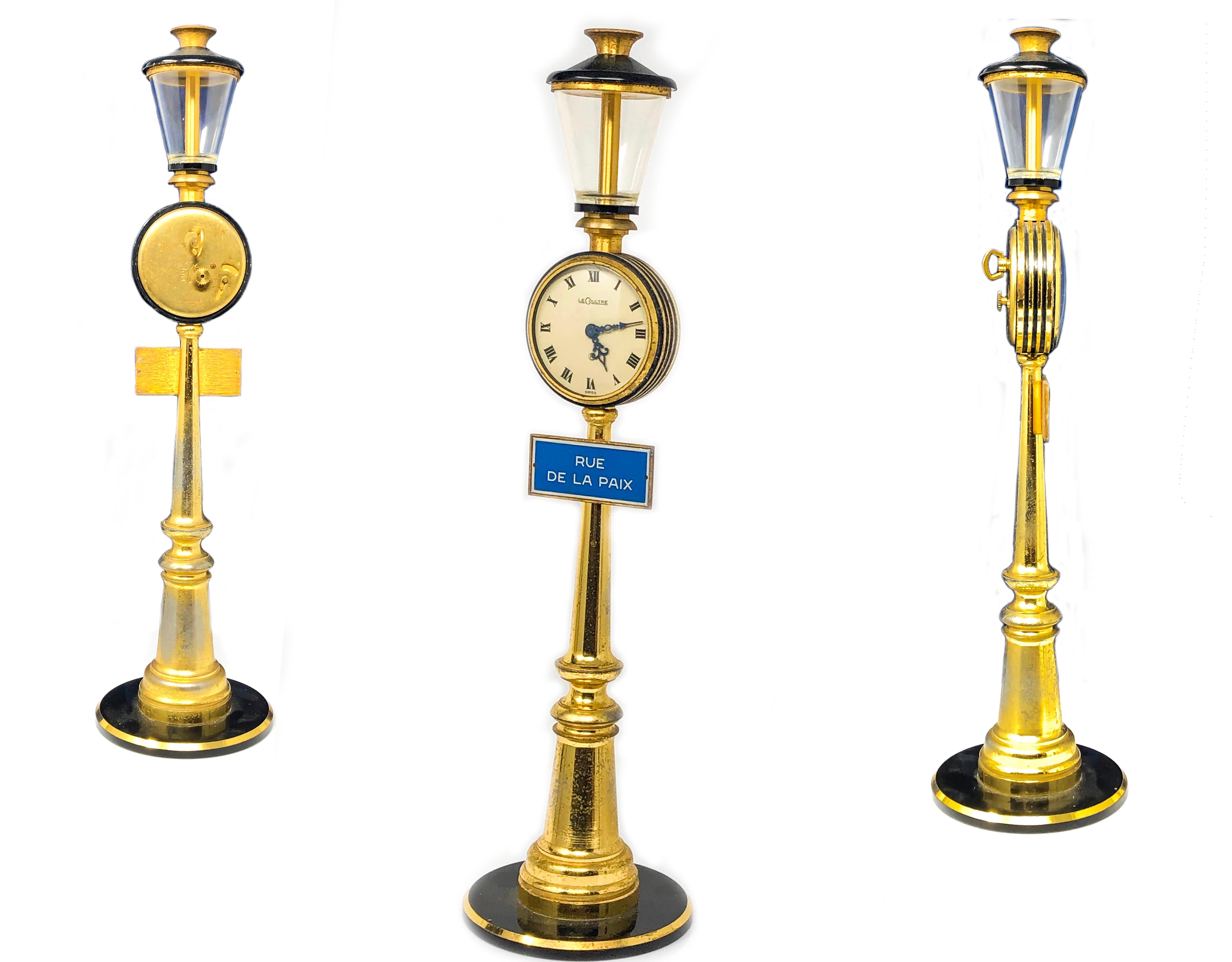  The present example, a 1960s Jaeger Le Coultre Gilt Metal & Black Lacquered Rue De La Paix Street Lamp Clock features a nickel-finished jewelled lever movement, the silvered dial with Roman numerals, blued steel pierced hands, the circular case