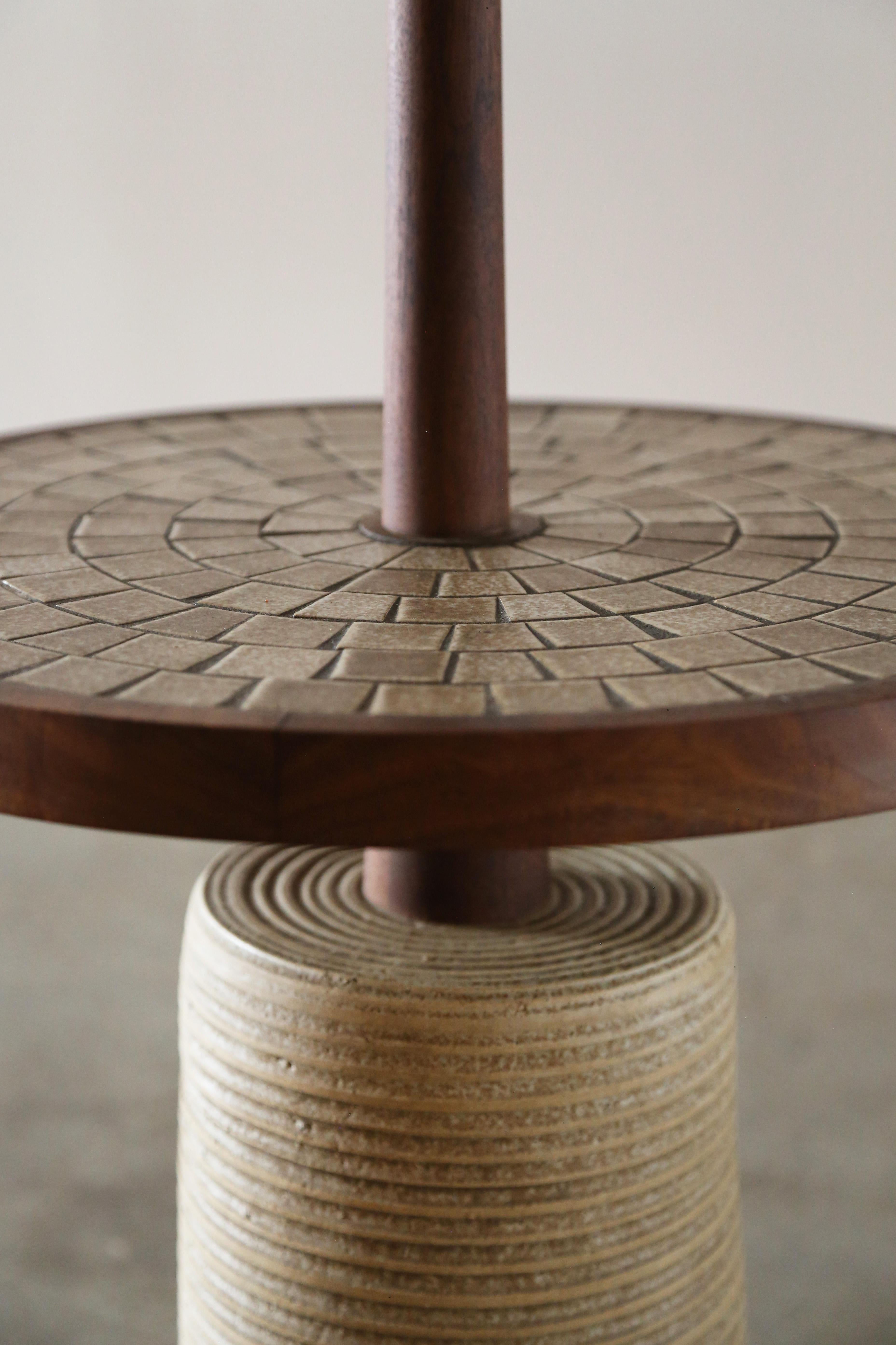 A 1960s mid century modern floor lamp with a large ceramic base and a mosaic tile table designed by Jane and Gordon Martz for Marshall Studios. Model 164 is an elusive lamp, that rarely surfaces. A beautiful design with a weighted bottom that gives