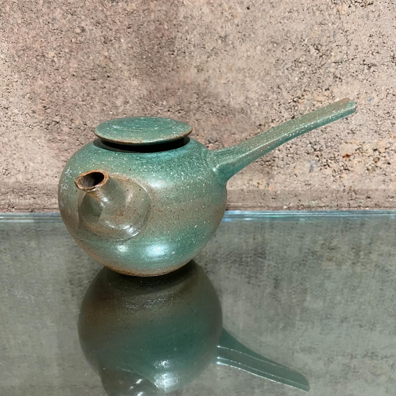Old Art Pottery Japanese Modern Green Tea Pot 
Artist signed
5 tall x 6 d x 8.5 w
Original preowned condition. Distress crack present.
Please see all images.

