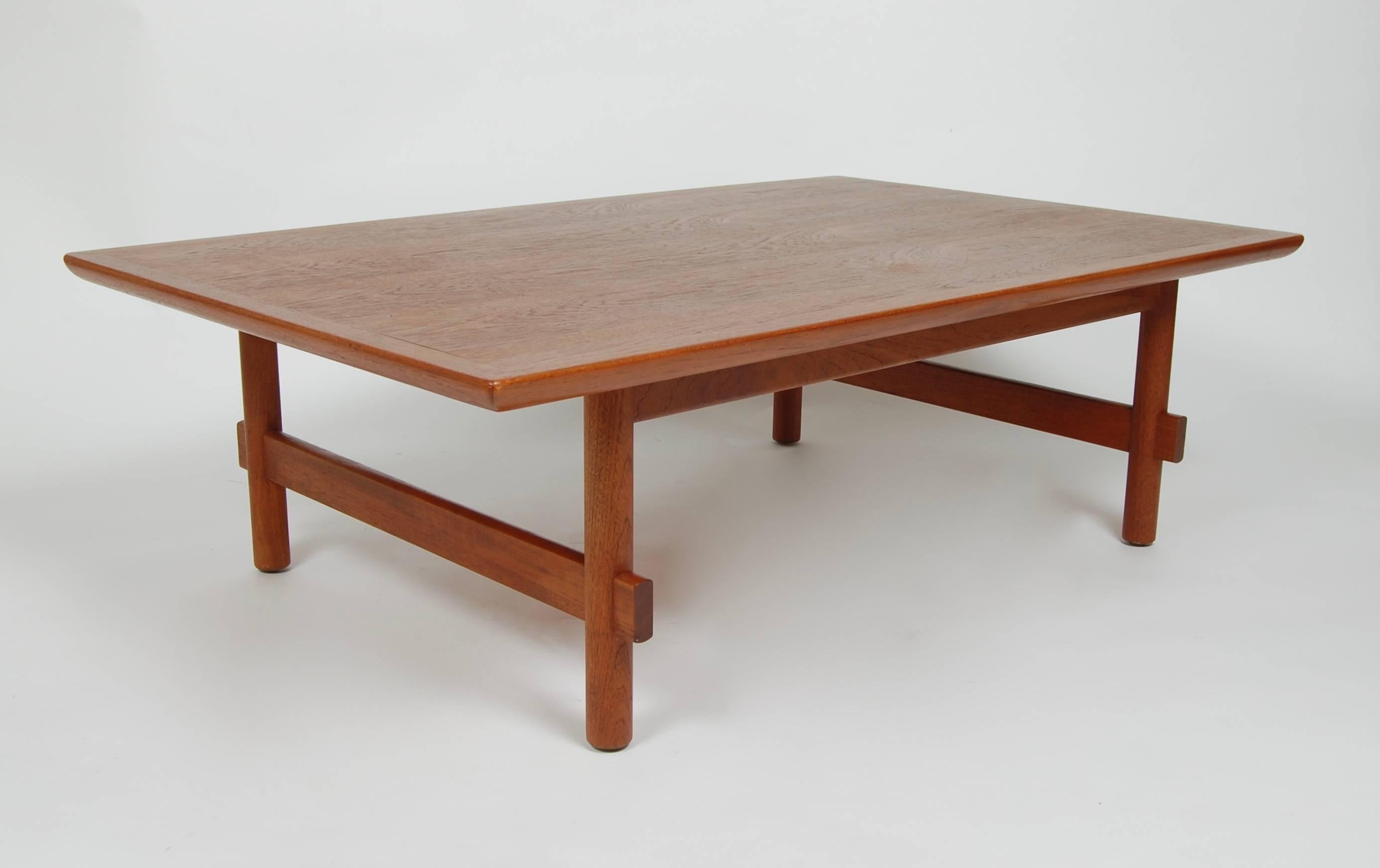 1960s rectilinear teak coffee table from Japan, clean simple and sleek lines with expressive bookmatched grain patterns to the top.