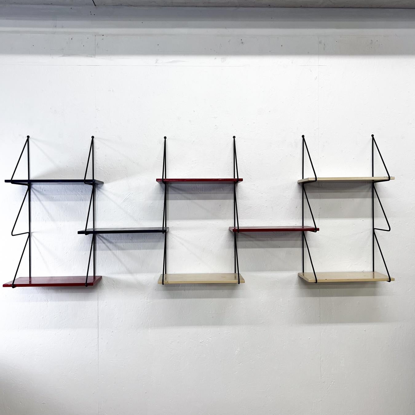
1960s Jazzy Modern Wall Unit System Eight Shelf Floating Display 
Red, white and black
76.53 w x 30 h 8.38 d
8 shelves
Preowned original vintage condition
See all images please.