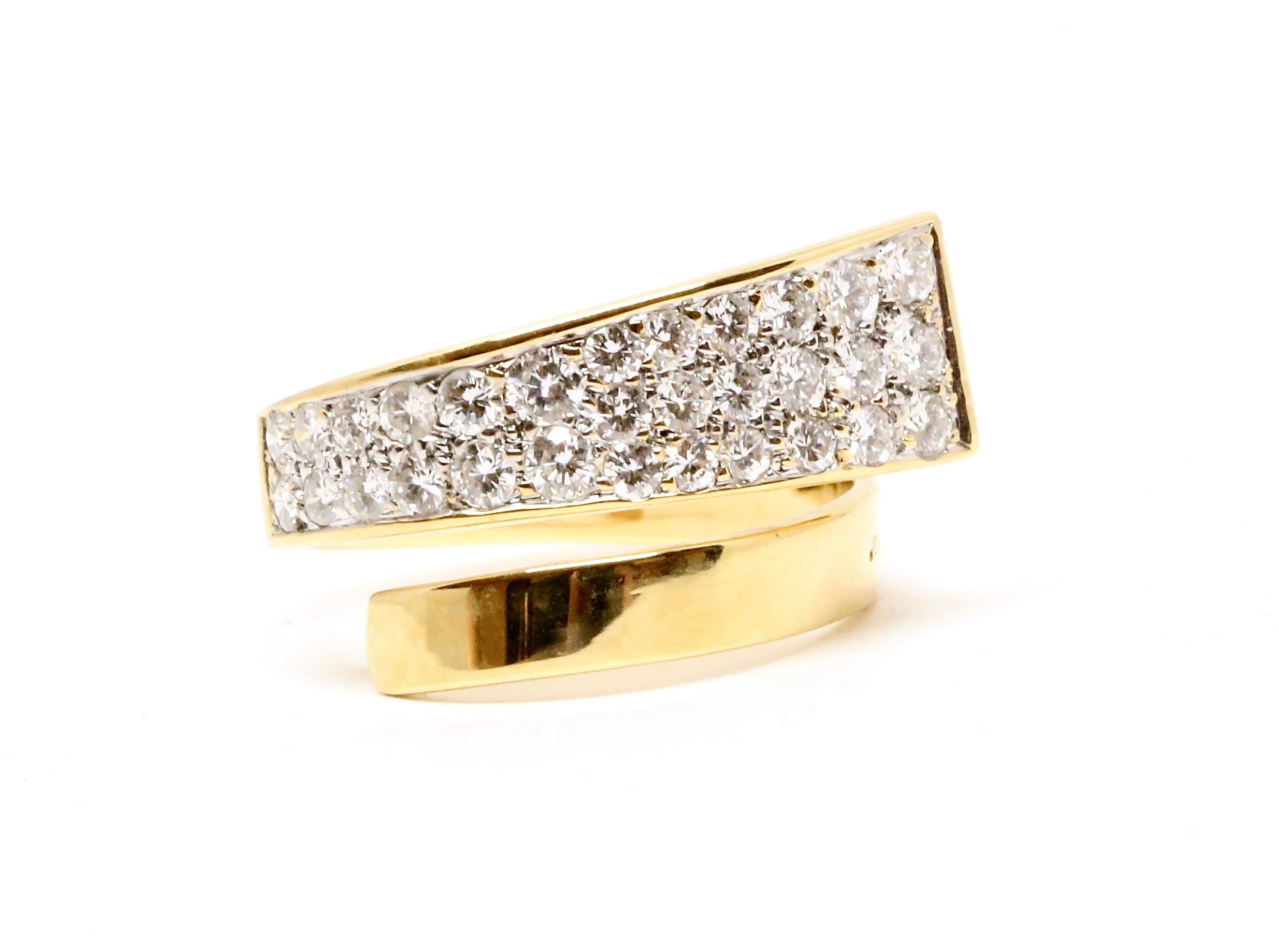 Very unusual, 18k yellow gold modernist wrap ring with diamonds designed by Jean Dinh Van for Cartier dating to the late 1960's. Ring is very delicate yet bold in appearance. It wraps around the finger. Ring best fits a US 6.5 and can be carefully