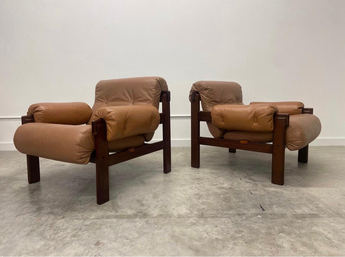 Gorgeous pair of lounge chairs made by Jean Gillon for Italma. These late 1950’s - early 1960’s chairs are made from Brazilian jacaranda wood and leather. Jean Gillon was born in Romania and later moved to Brazil. His style is distinct and often