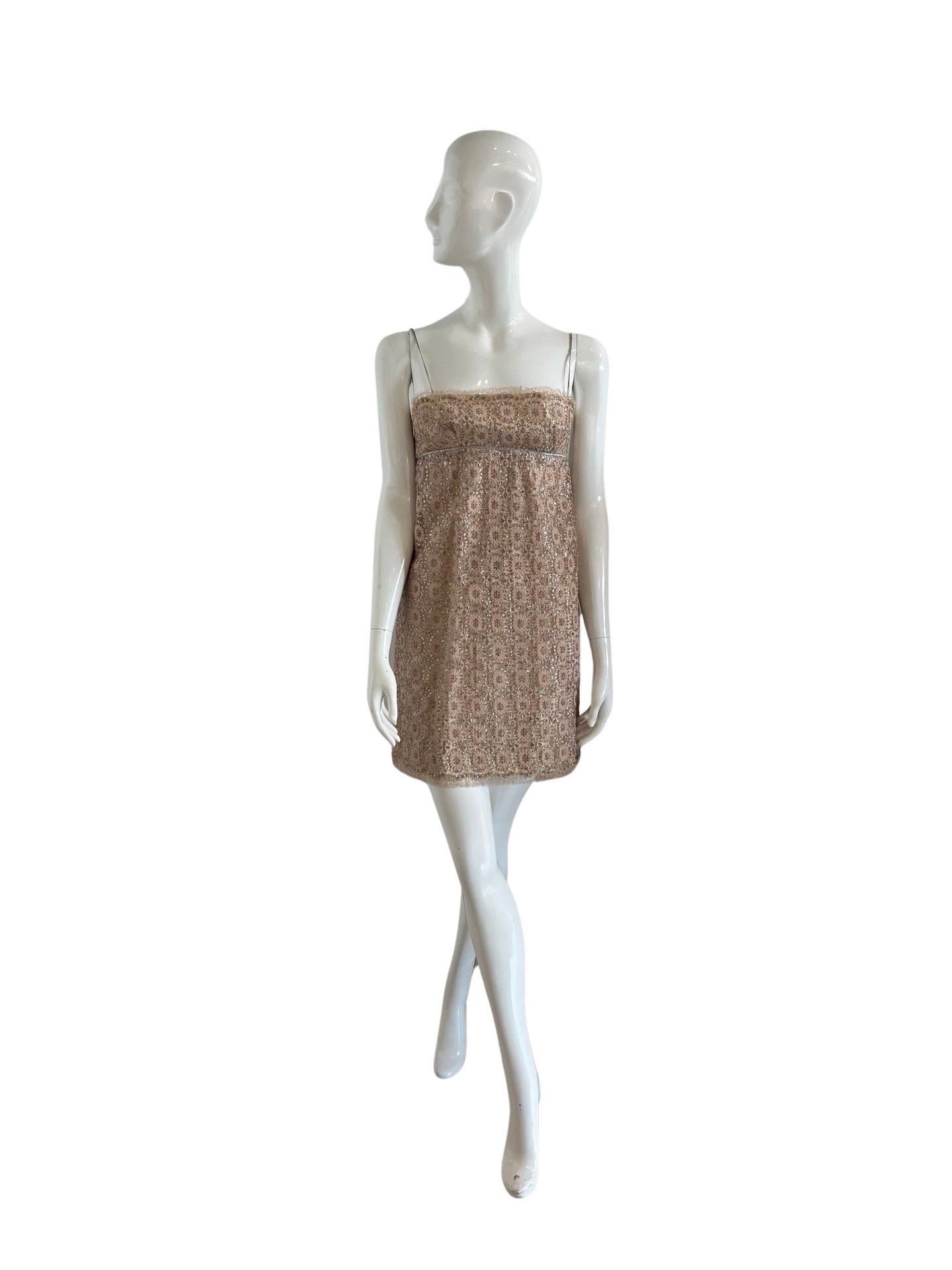 The most beautiful 60s vintage mini from the English label Jean Varon which was designed by John Bates in the 60s and 70s.  Bates was one of the pioneers of the miniskirt.  This babydoll style mini dress is done in pink and silver lace with silver