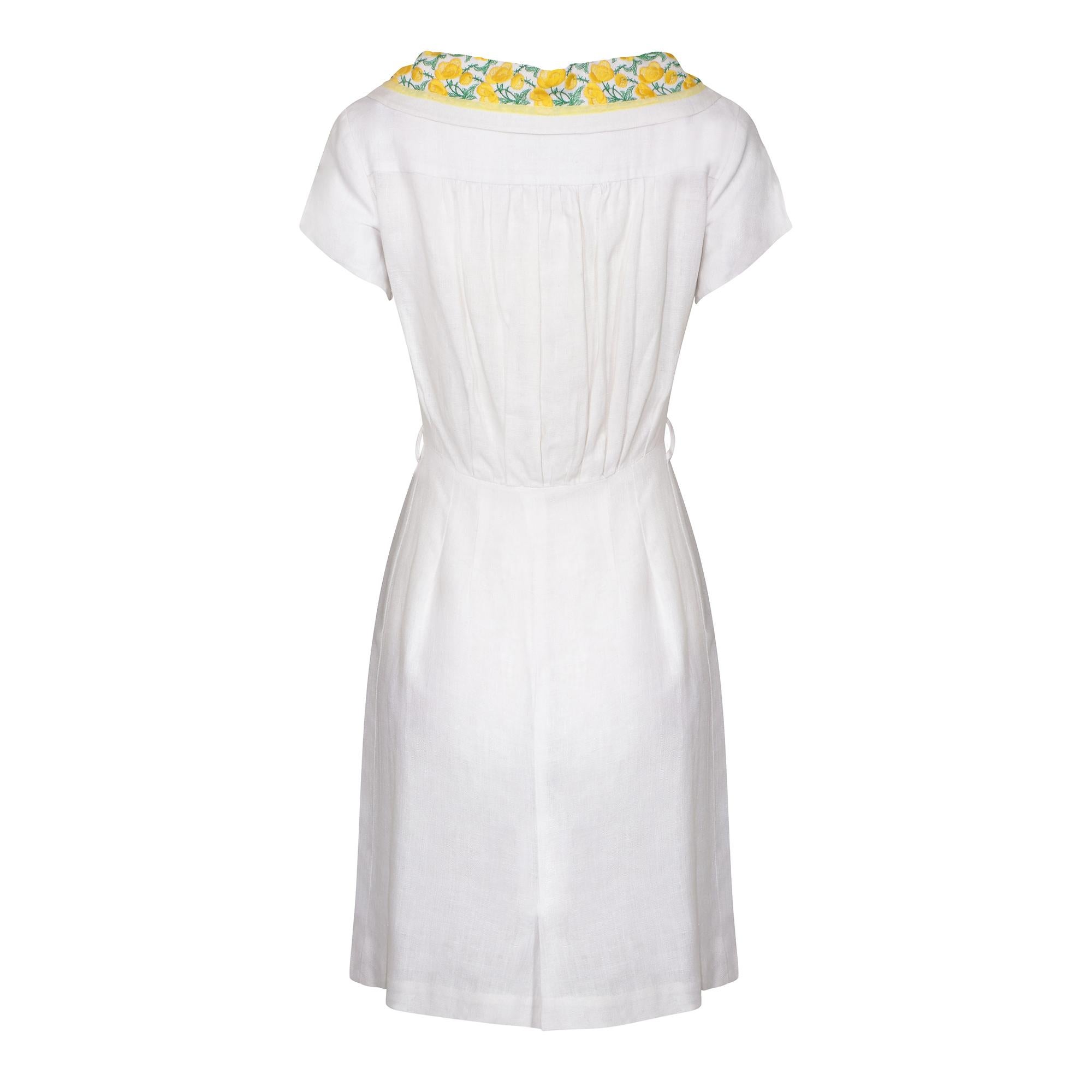 The quality of this white Irish linen dress is second to none. The design is by Jennifer Lee and we often see this Moygashel pure Irish linen label in dresses from this era. This is a delightful shirt-waister dress with a button stand of 6 cream