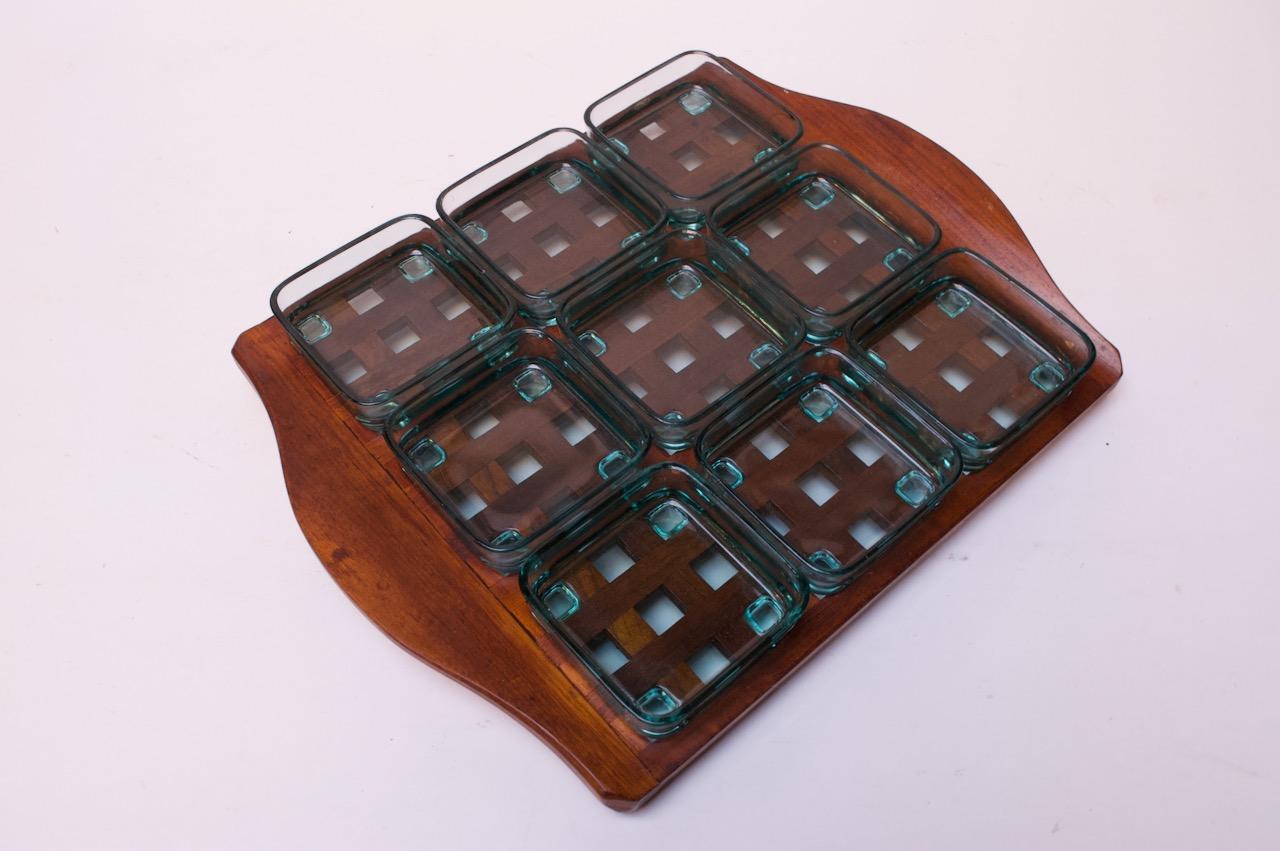 Danish 1960s Jens Quistgaard teak lattice serving tray with green, tempered glass inserts. Each glass dish has feet, which fit perfectly into the grid.
The set is in excellent, vintage condition with only minor wear to the tray. Glass inserts are