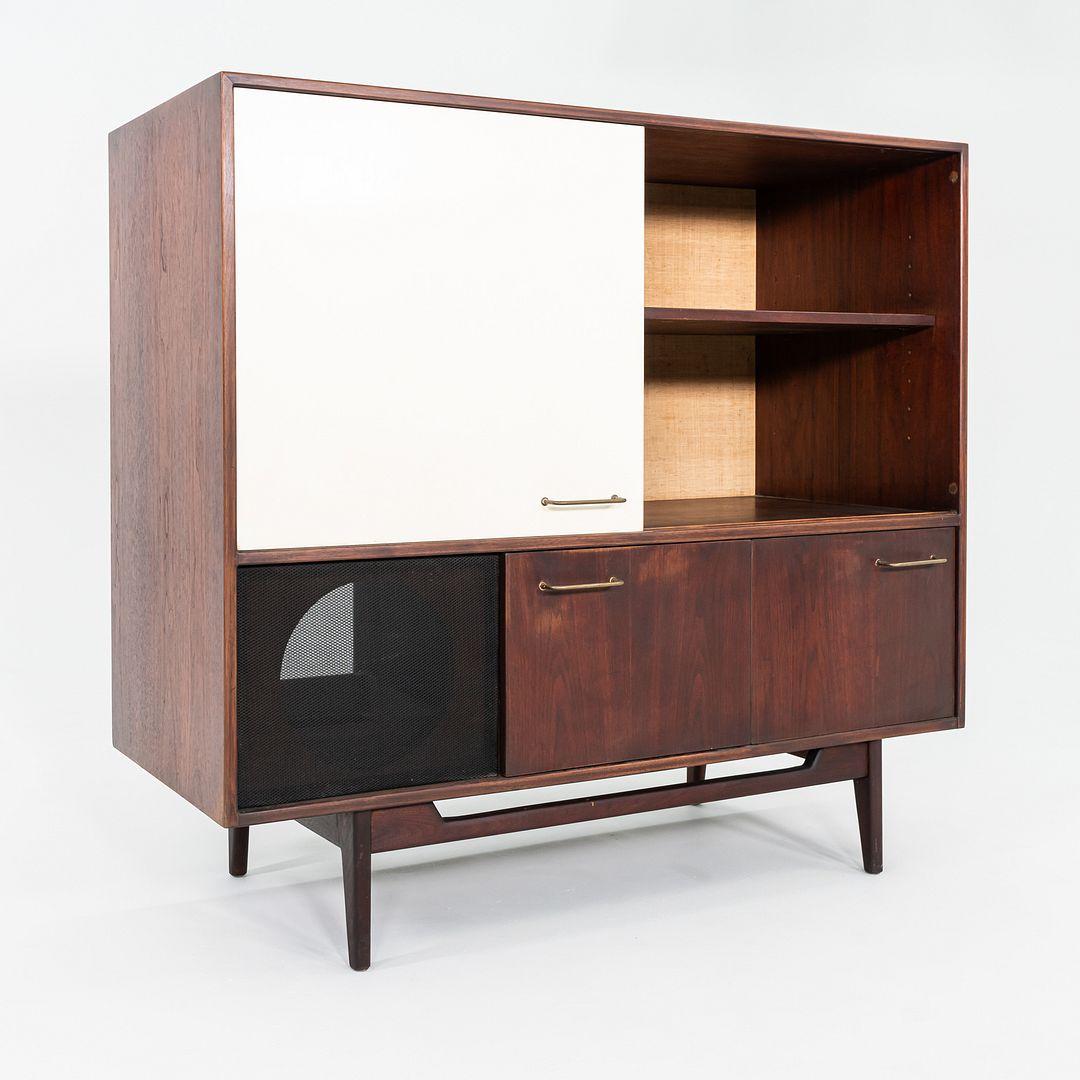 This is a Large Entertainment Cabinet, designed by Jens Risom for Risom Designs in the mid-1960s. The unit stands on four tapered legs, and has rich walnut veneered sides. There is plenty of room for your updated entertainment components, though