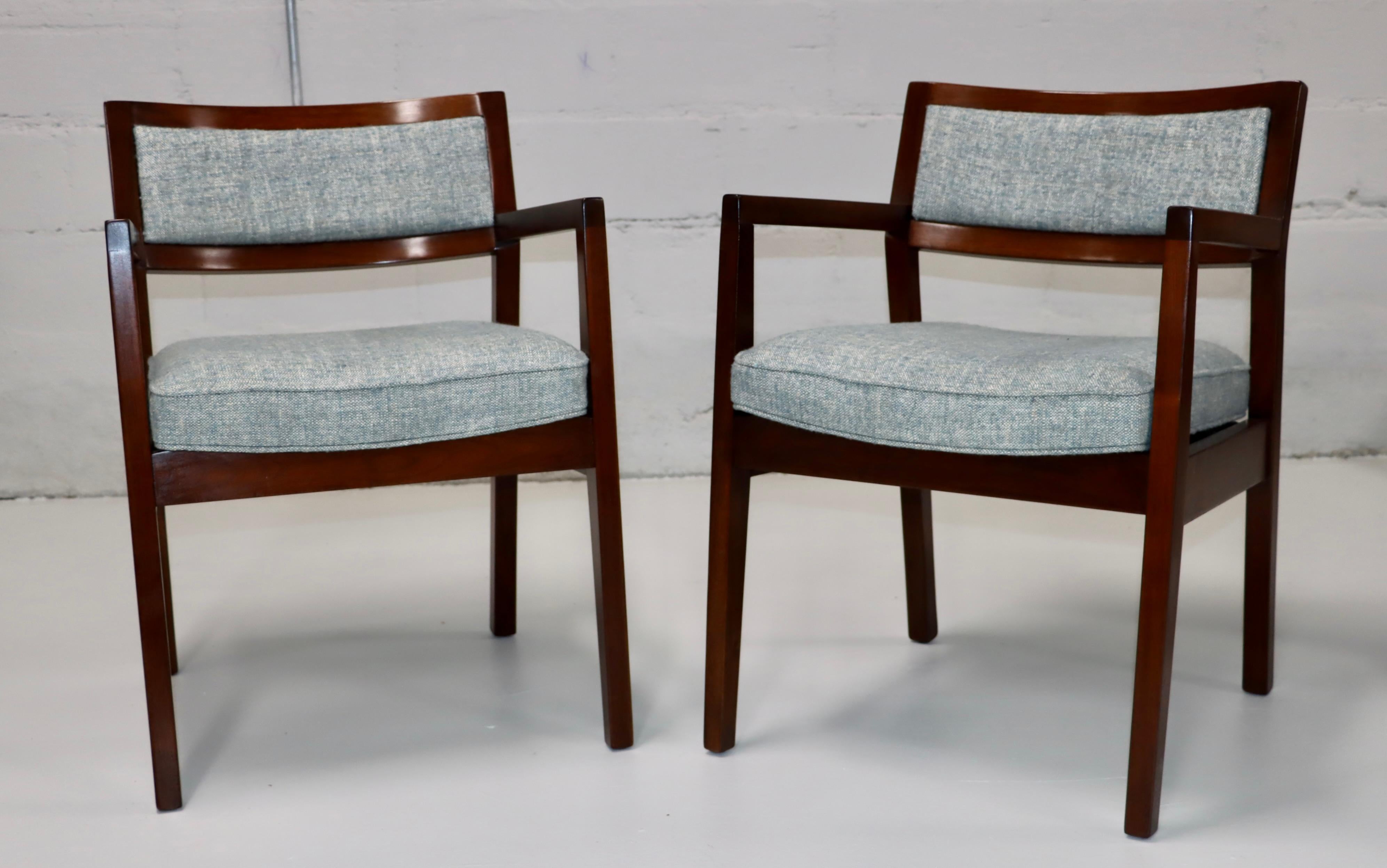 1960's mid-century modern walnut and fabric armchairs in the style of Jens Risom, fully restored and re-upholstered, with minor wear and patina due to age and use.