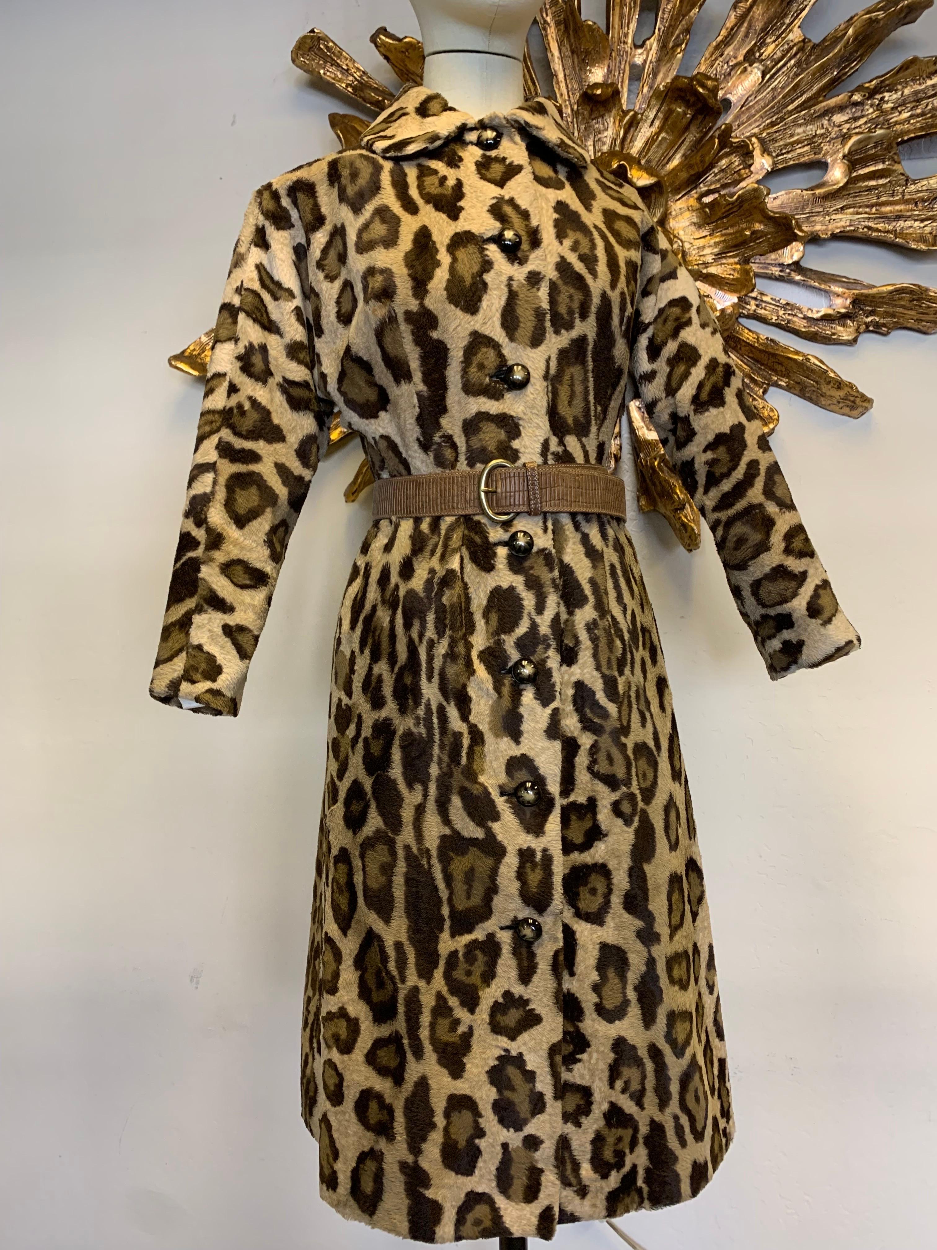 1960s Jerry Silverman Faux Leopard Fur Button-Down Coat Dress: Dolman sleeves with side slit pockets. Includes a modern leather belt by Armani. Fully lined. Size 6-8