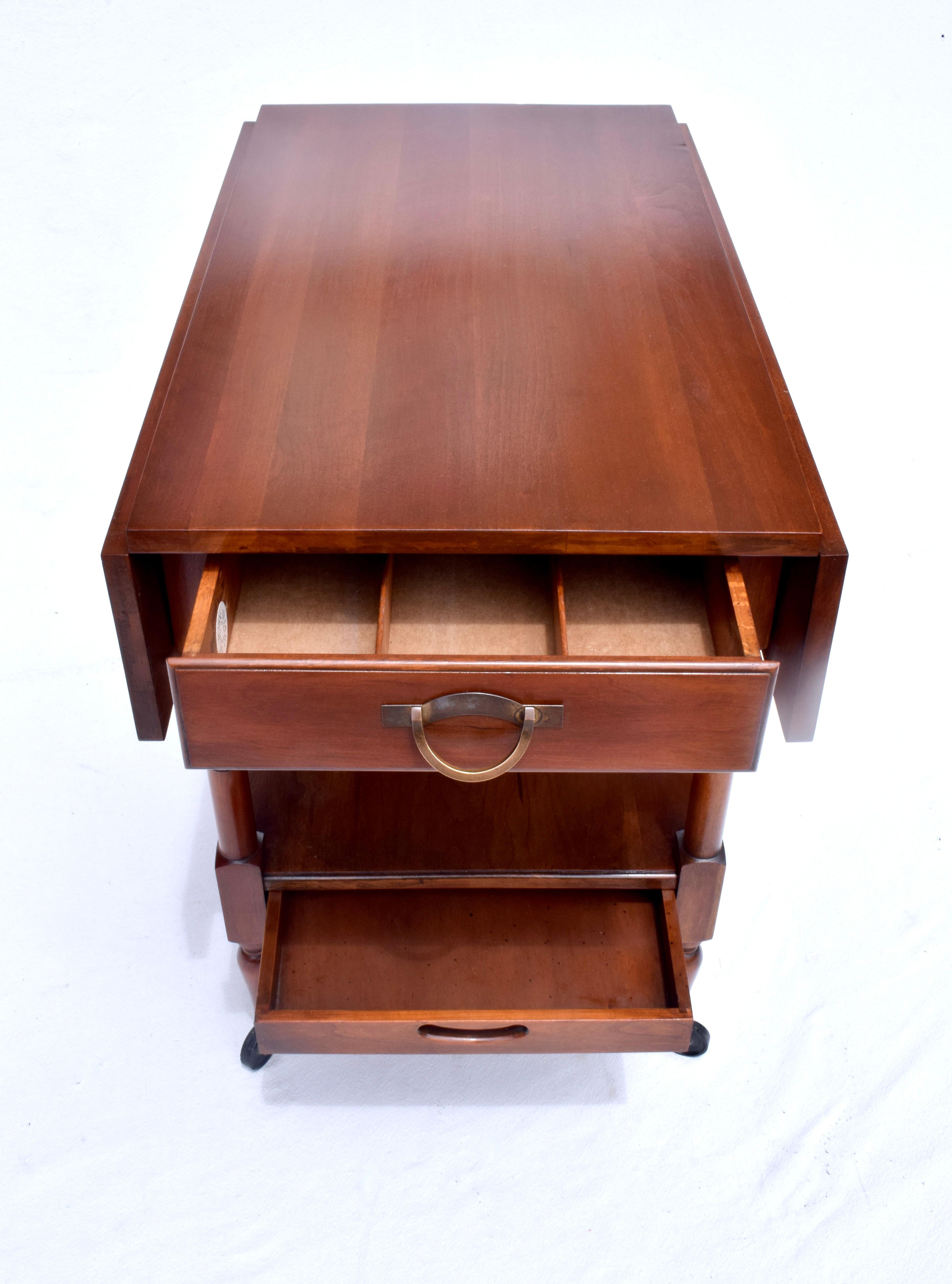 Solid Cherry two tier drop leaf tea trolly / bar cart with two dovetail drawers on casters by John Stewart. A very sweet, practical & Transitional design suitable for any setting. Dimensions with leaves extended:  32