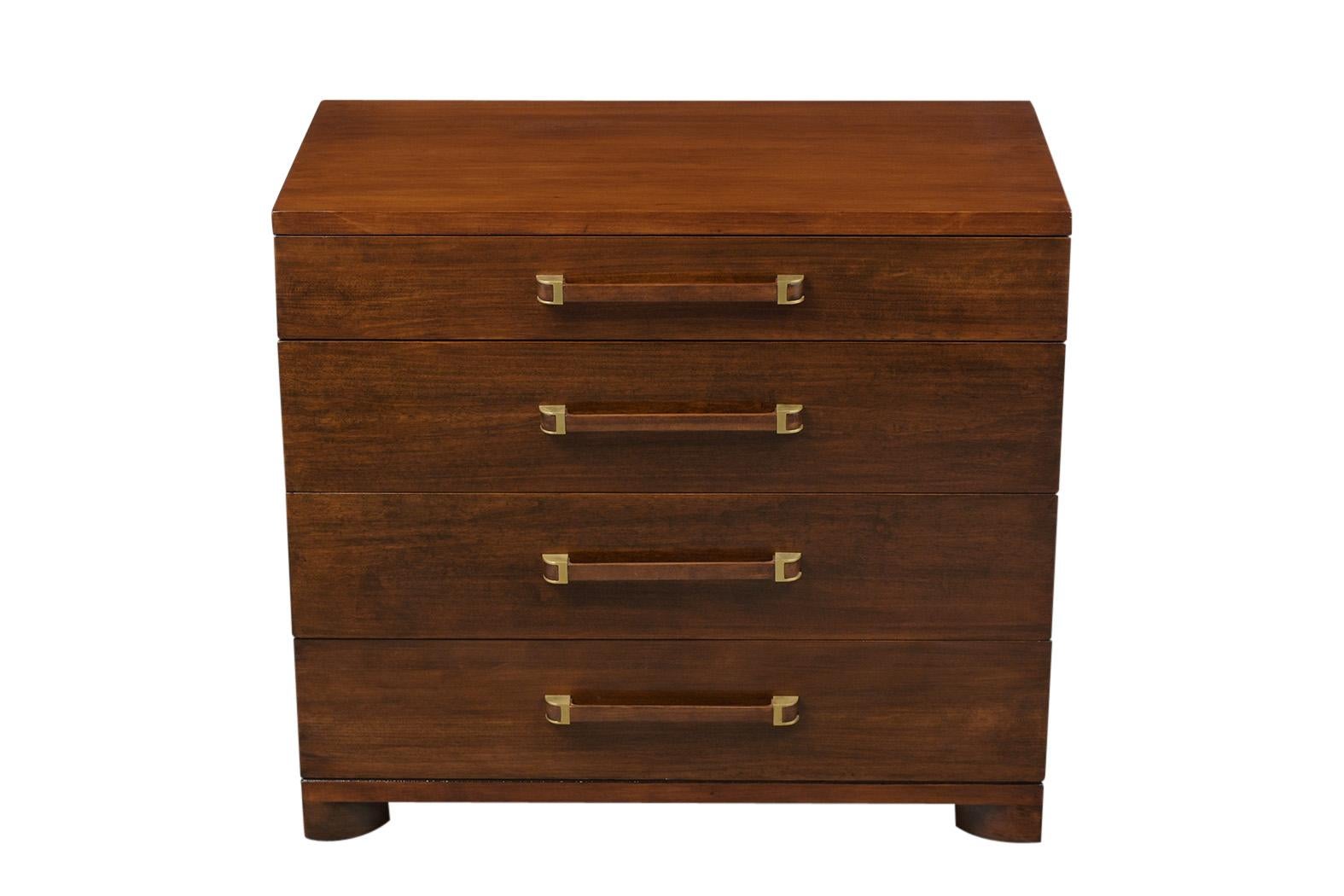 This is a 1960s dresser. Made by John Widdicomb Company, using solid walnut wood. That has recently been stained in a rich walnut color, with a lacquered finish. Dresser features 4 vertical drawer. The first drawer has dividers, the next 3 drawers