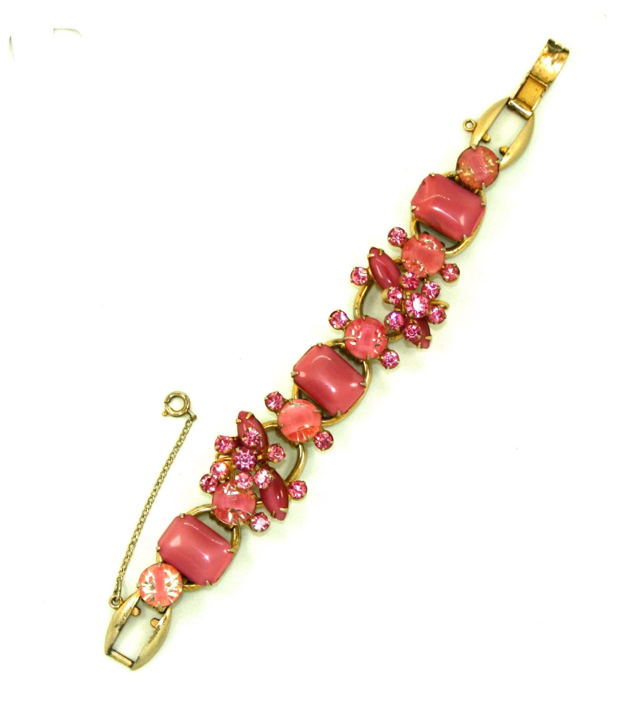 Stunning pink stone bracelet from the Juliana line by American costume jewellery company DeLizza & Elster. An array of dusky pink satin glass (or pink moonstone), bi-coloured and diamante stones are prong set into a classic Juliana bracelet