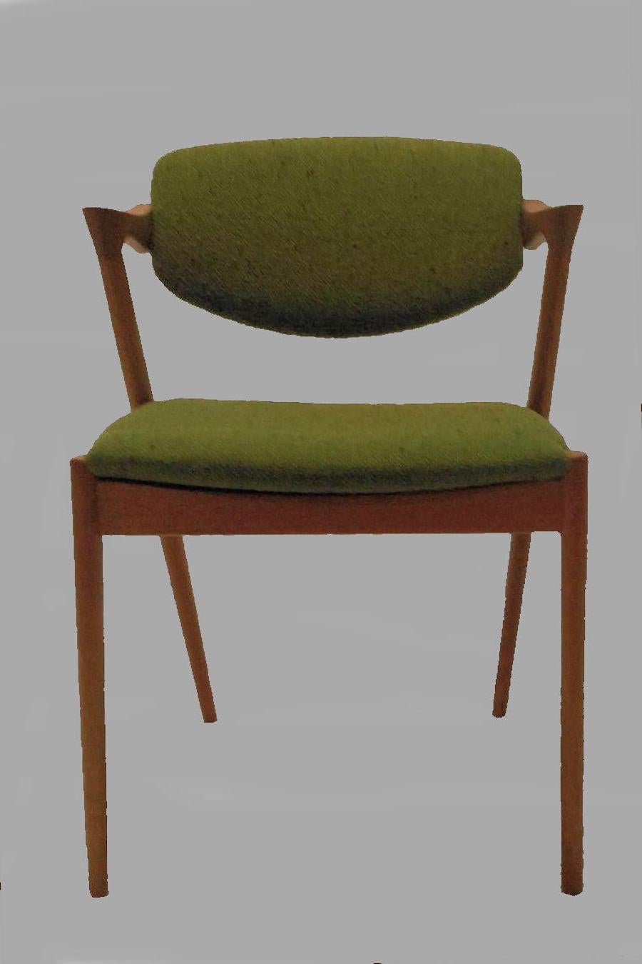 Set of 10 restored model 42 oak dining chairs with adjustable backrest by Kai Kristiansen for Schous Møbelfabrik.

The chairs have Kai Kristiansens typical light and elegant design that make them fit in easily where you want them in your home - a