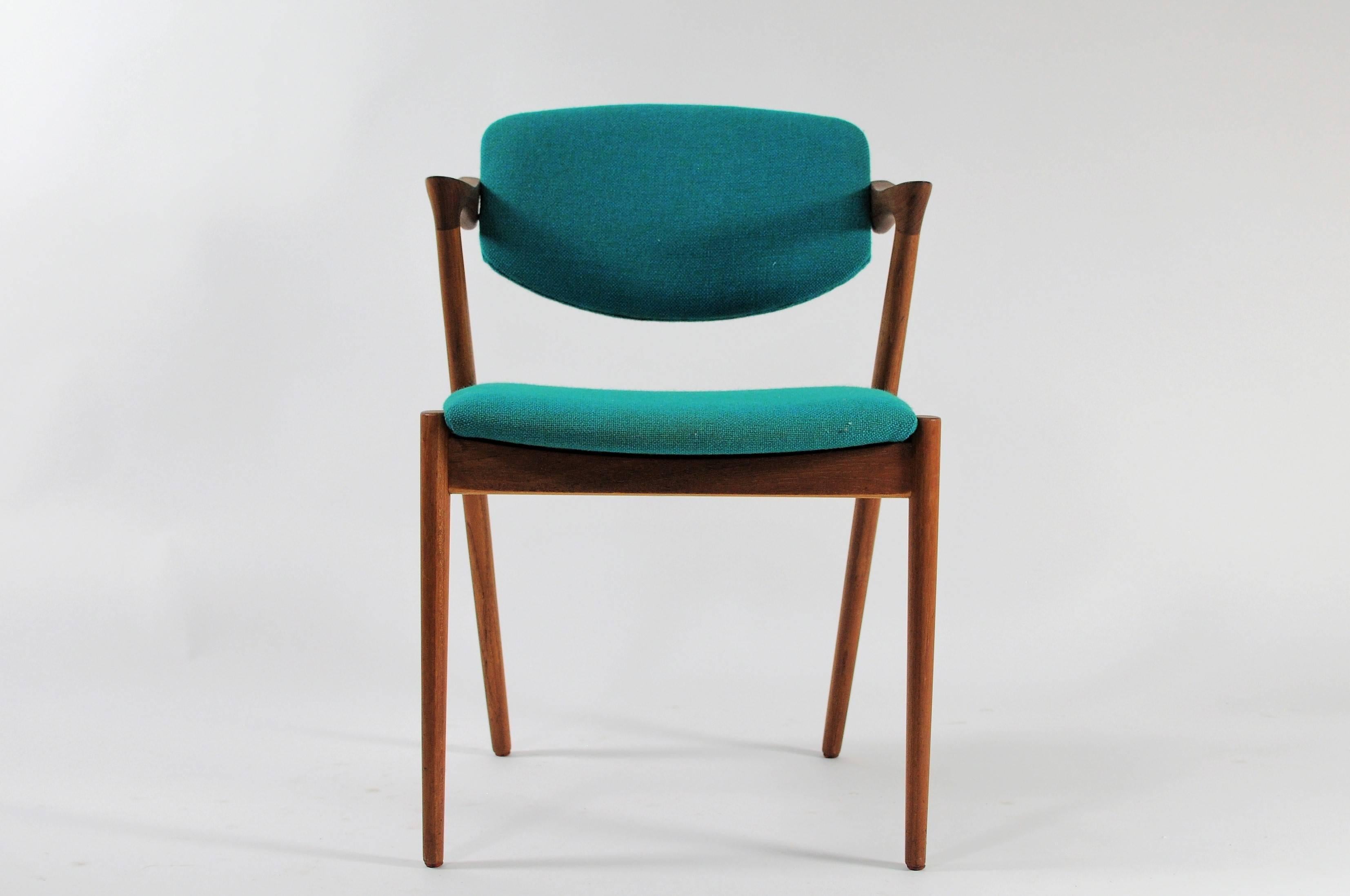 Set of 4 model 42 teak dining chairs with adjustable backrest by Kai Kristiansen for Schous Møbelfabrik.

The chairs have Kai Kristiansens typical light and elegant design that make them fit in easily where you want them in your home - a design
