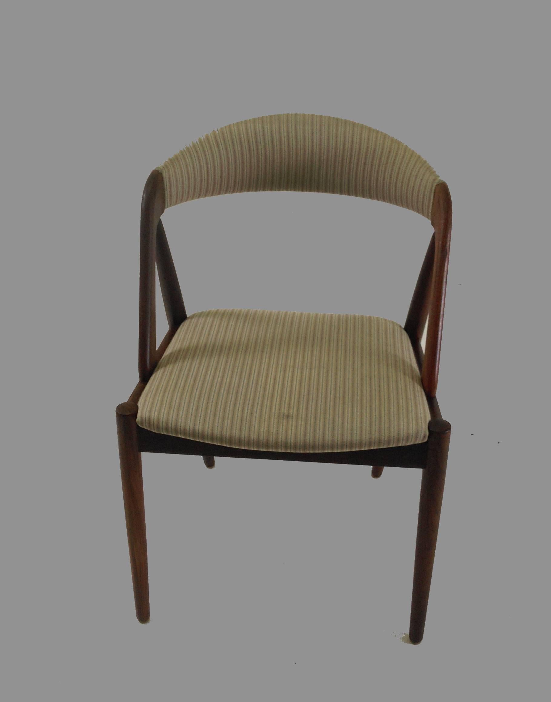 Model 31 is one of the most well-known chairs designed by Kai Kristiansen - a true Classic with its curved backrest, crooked angles, straight lines and is as all of Kai Kristiansens chairs very comfortable. The A-frame model 31 dining chairs were