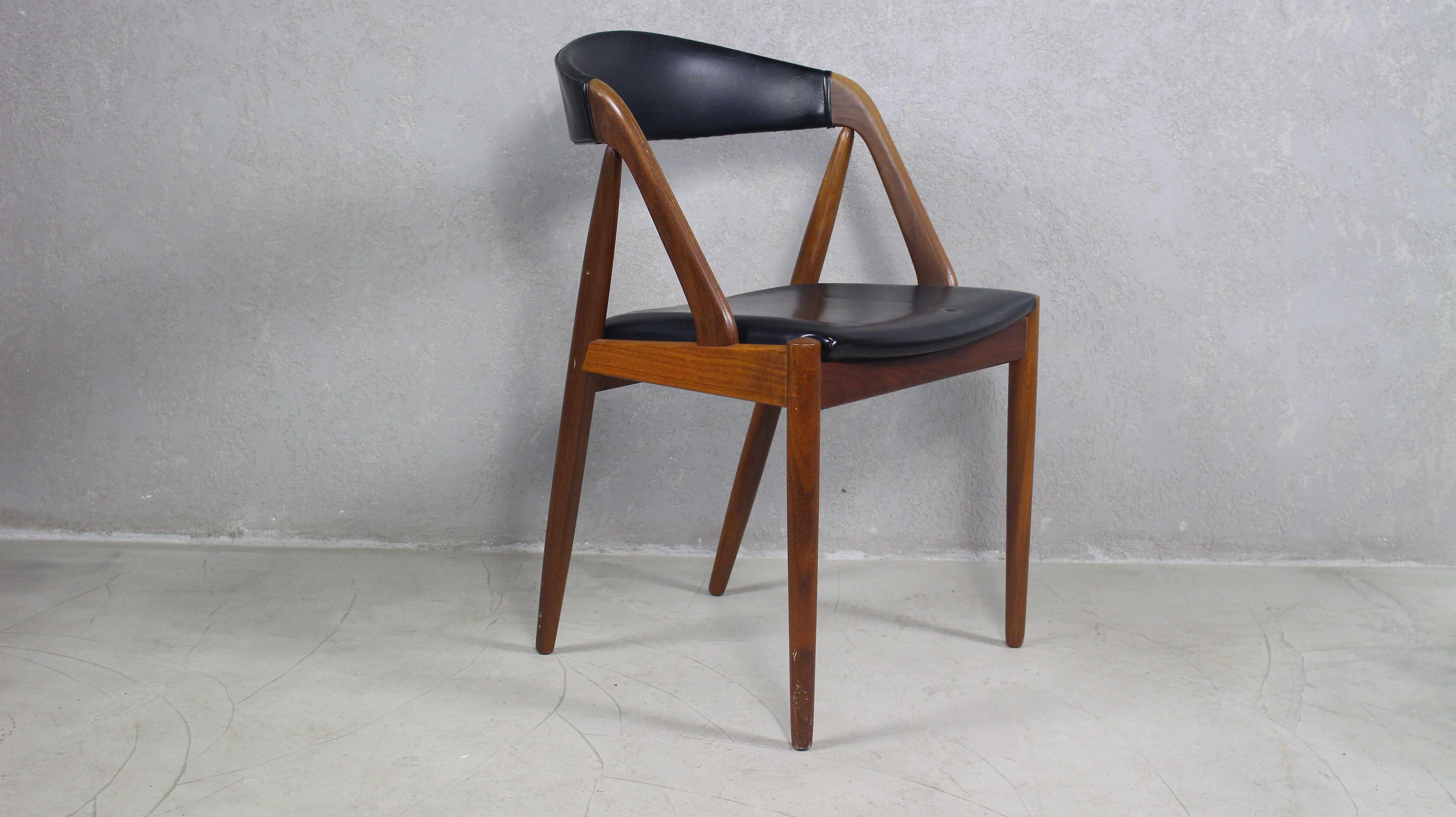 Truly elegant original 1960s vintage Kai Kristiansen Model #31 accent chair in excellent condition.
 This is an early, sought after vintage model, with high quality teak wood and a more elegant frame and design than the later ones.
The teak shines