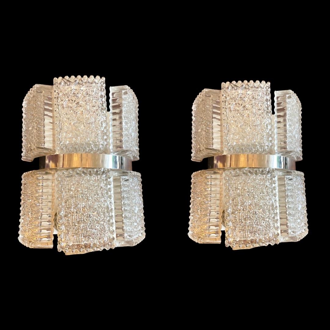 Decorative Original Pair of 1960s Textured Frosted Glass Wall Lights, thoughtfully designed by Kaiser Leuchten in Germany during the 1960s.

With their exquisite blend of classic retro aesthetics and modern elegance, these wall lights possess a