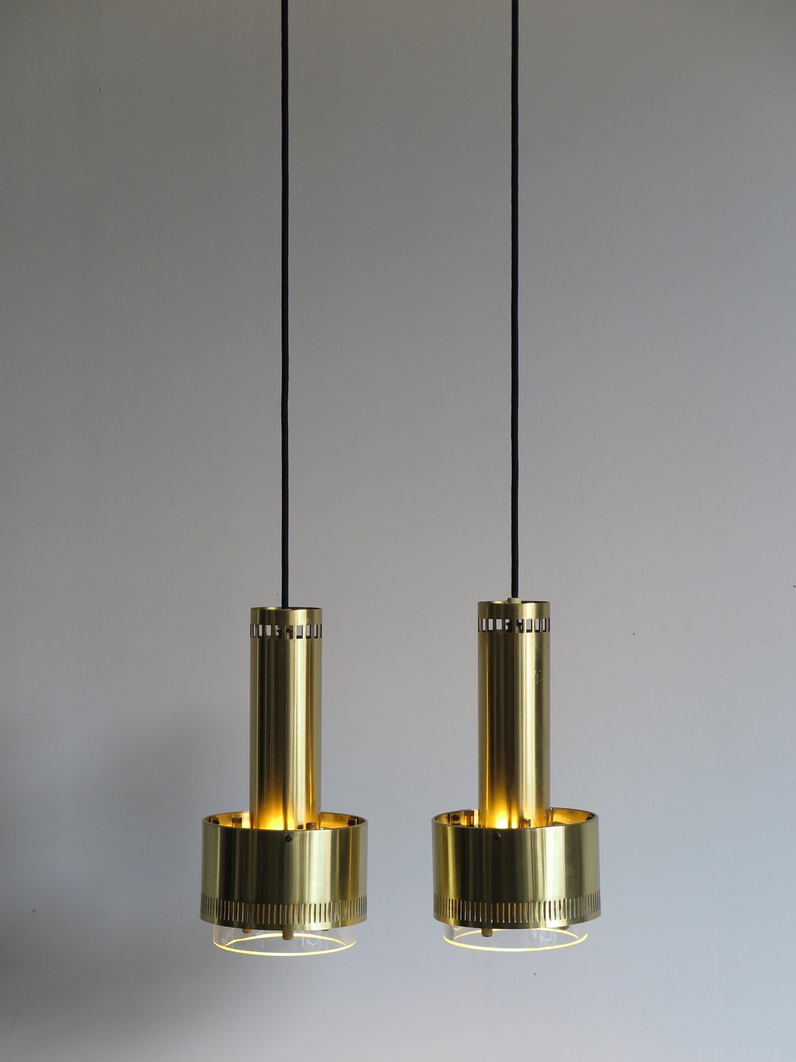 1960s Danish pendant iconic and amzing lamps designed by Kay Korbing for Lyfa, perforated brass with a one centimeter thick glass lampshade; designed in 1967 to Princess Margrethe and ships of Winston Churchill.
Source: Lyfa catalogue 1972.

When