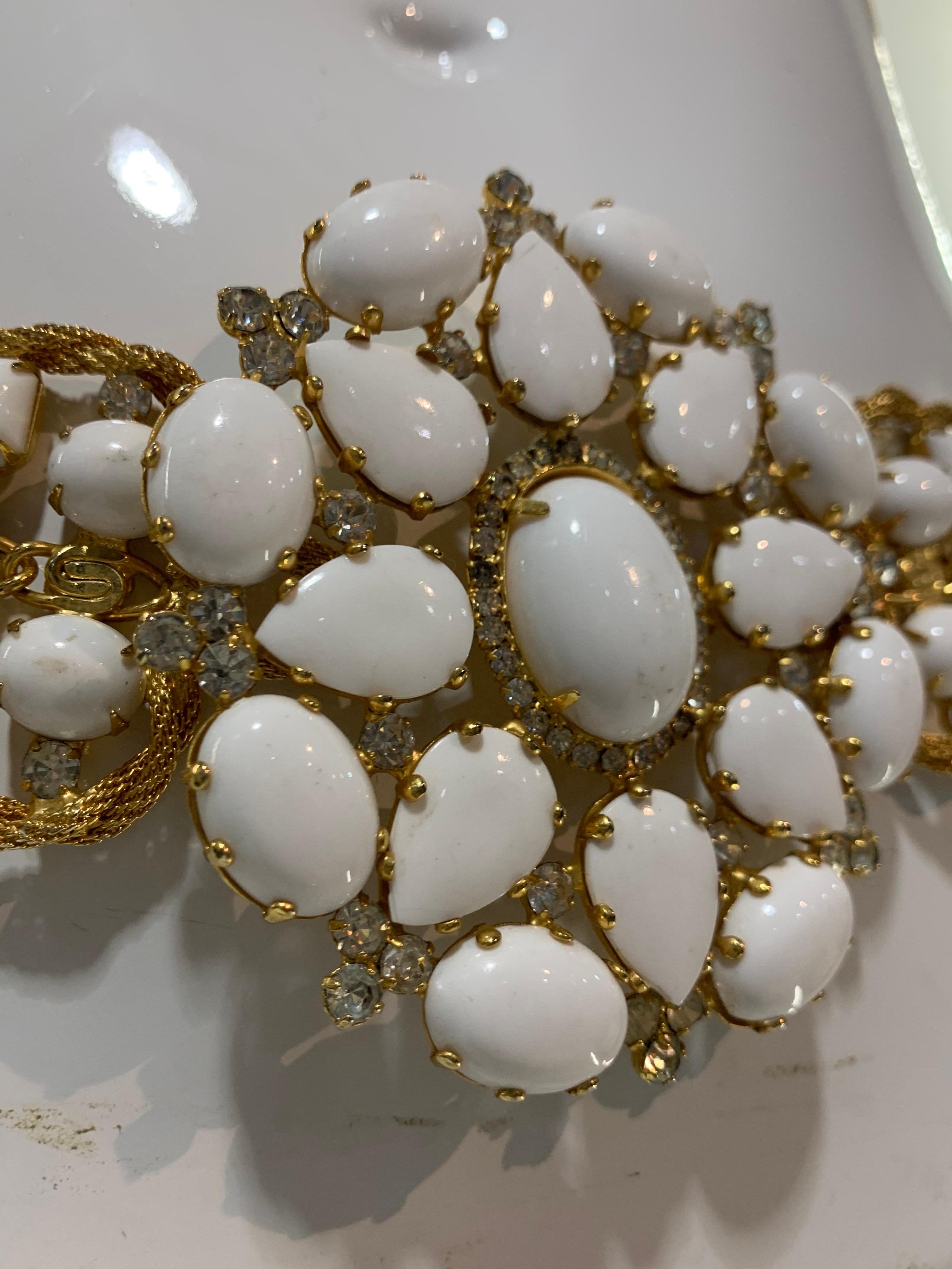 A fabulous, wide 1960s Kenneth Jay Lane jeweled gold-tone belt w/ milk glass & rhinestones set in heavy gold chain link. Adjustible between size 6-8.