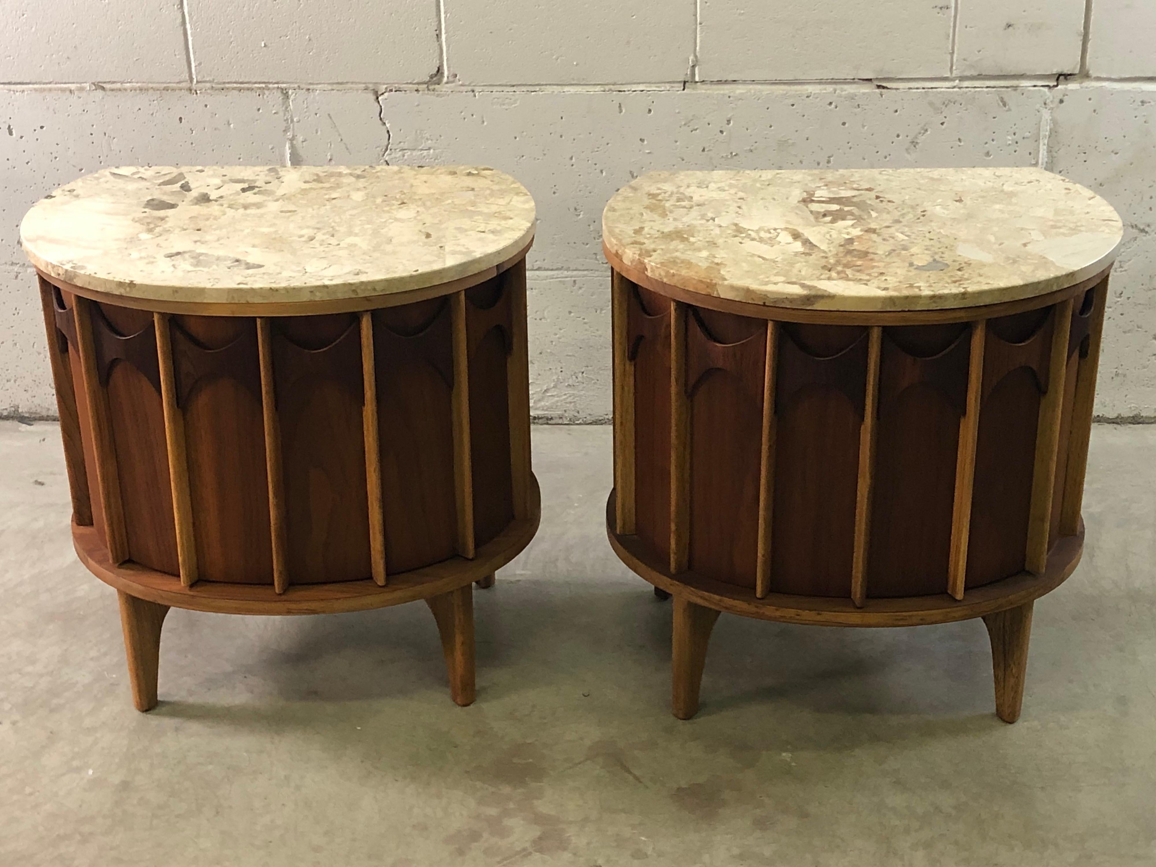 Vintage 1960s pair of Kent Coffey Perspecta end tables in walnut and pecan wood with marble tops. The tables are half round with a single drawer inside. They have been recently refinished and are in excellent condition. The marble tops are perfect
