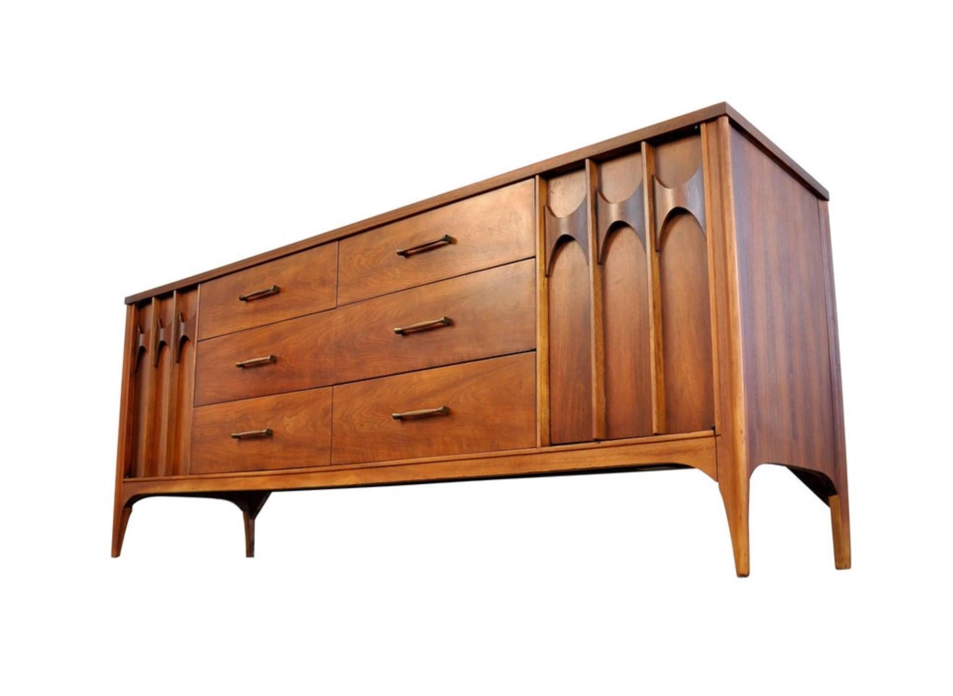 United States designed and made, this dresser features a great look with modern clean lines and sculptured elements such as the arches on the drawers. The appeal is enhanced by high-end construction, using walnut for the main body and solid rosewood