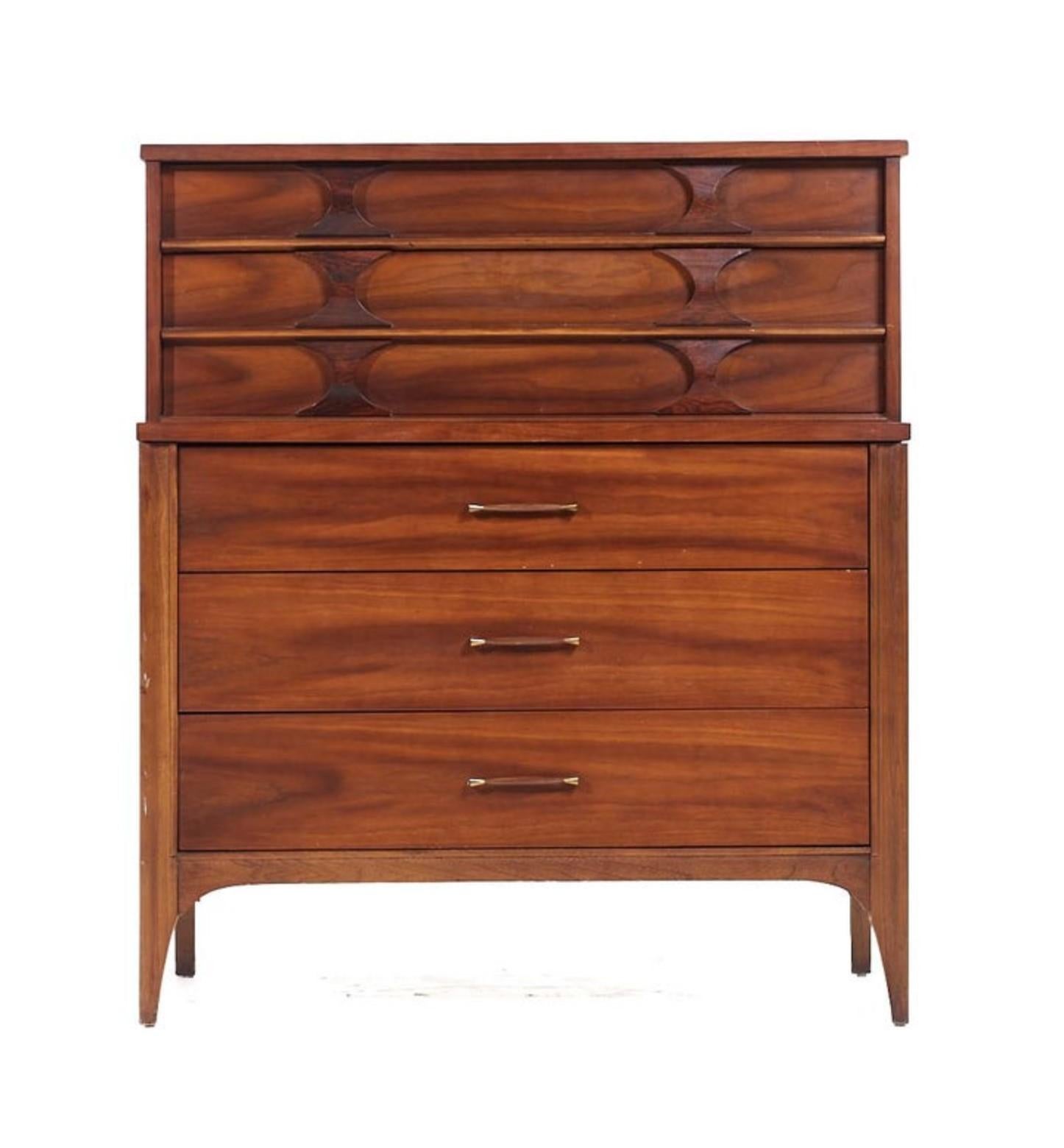 United States designed and made, this dresser features a great look with modern clean lines and sculptured elements such as the arches on the drawers. The appeal is enhanced by high-end construction, using walnut for the main body and solid rosewood