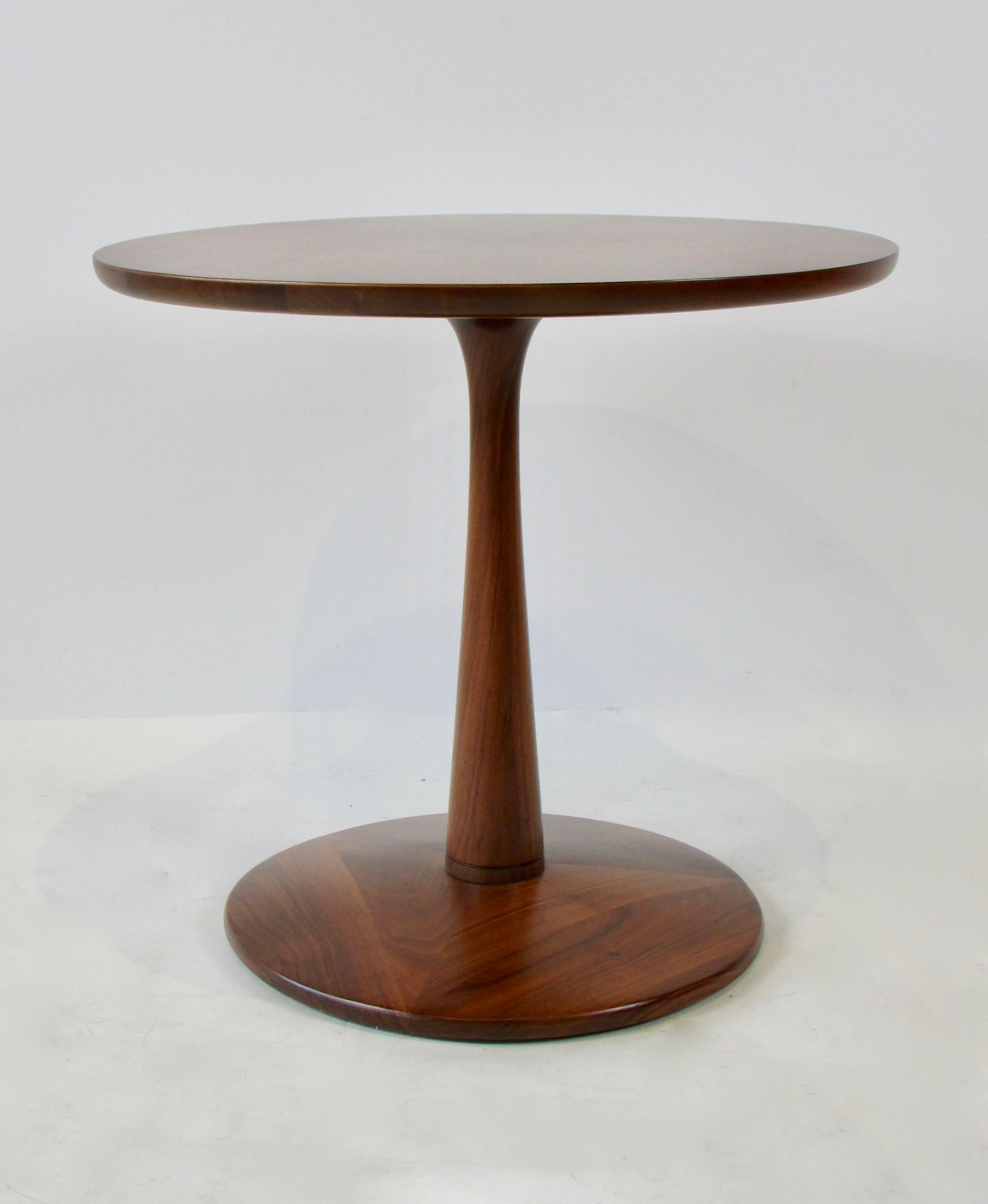This Kipp Stewart for Drexel side table from the Drexel Declaration line features a beautiful walnut veneer and elegant pedestal base. Very recently professionally restored.