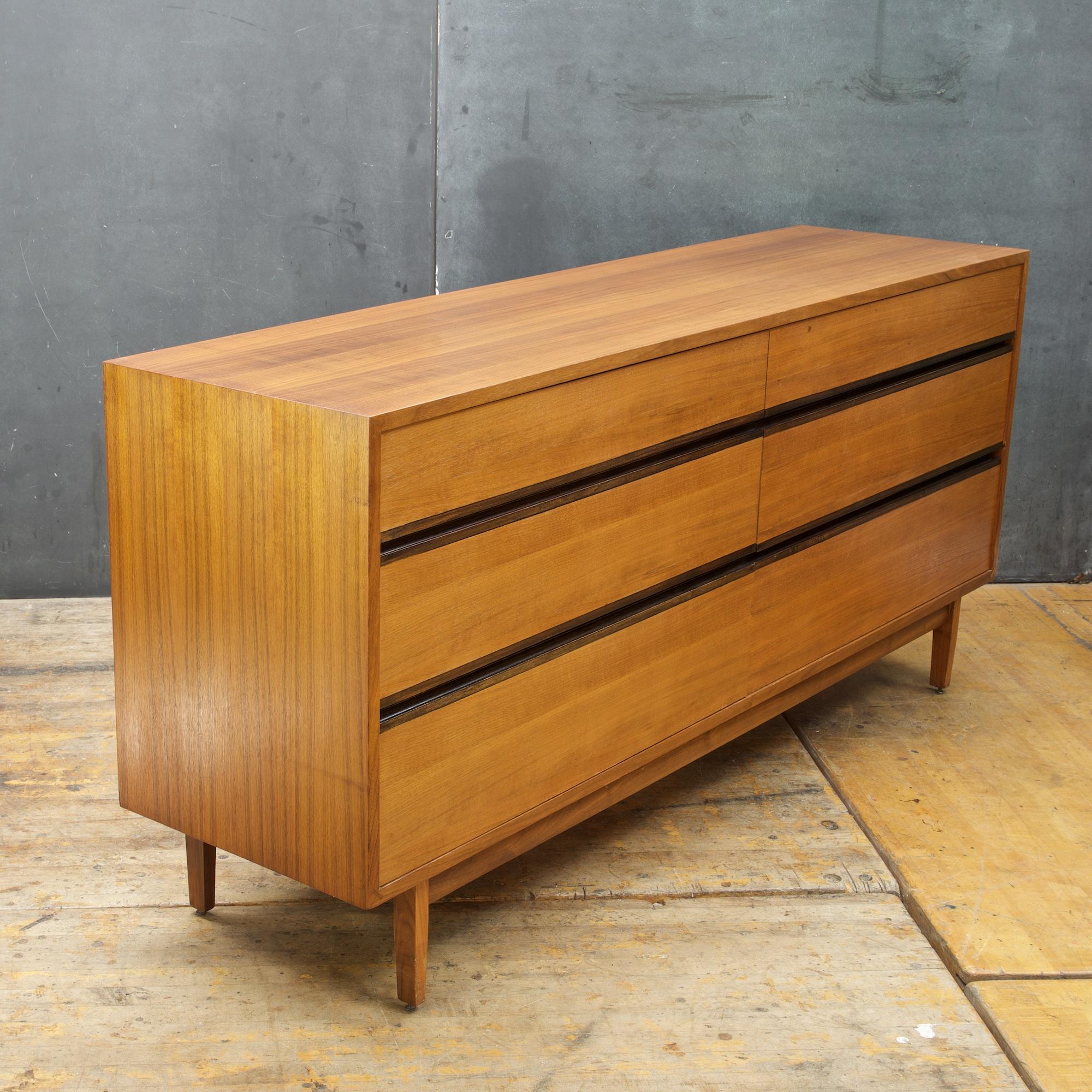 Matching pair of oiled walnut nightstands designed by Kipp Stewart for Calvin Furniture's American Design Foundation line. Rare design, with wonderful a nice white interior back surface. Original finish.

Measures: W 66 x D 17 x H 30 1/4 in.
 
