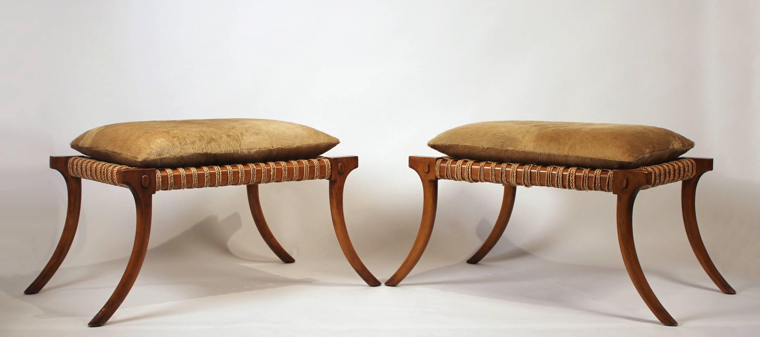 Large-scale pair of 1960s vintage Klismos stools wrapped in cording with hair on hide cushions. In the style of T.H. Robsjohn-Gibbings for Saridis of Athens. 

Measure: The height without the cushion is 17.5