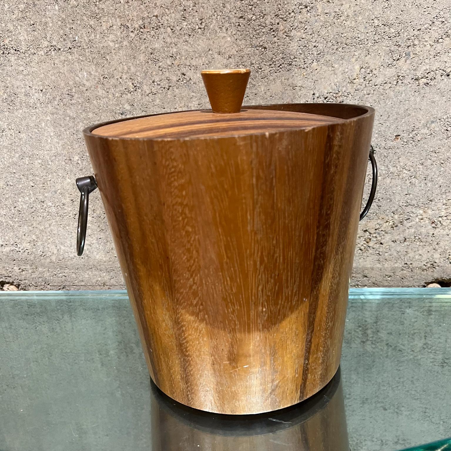 1960s KMC Barware vintage ice bucket teak wood Sensational Japanese Vintage modern ice bucket   
Original vintage unrestored condition. 
Stamped underneath KMC 
9.5 h x 8 diameter
Scratches are visible.
Refer to all images provided.



