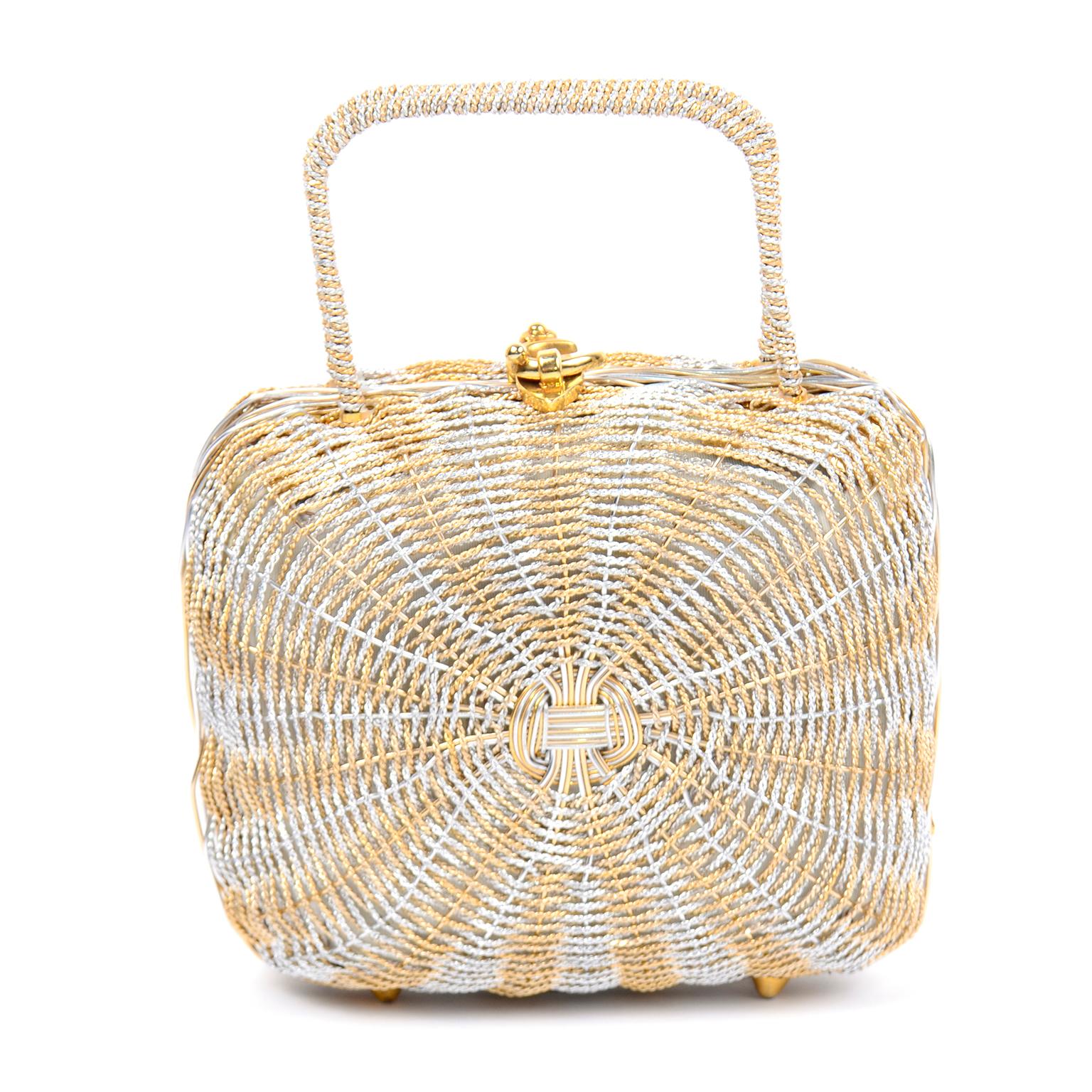 This fabulous vintage Koret mid century  woven silver and gold metallic handbag can be worn during the day or on an evening out.. The bottom of this lovely structured handbag has gold tone feet and there are metal hinges. The inside of the bag is