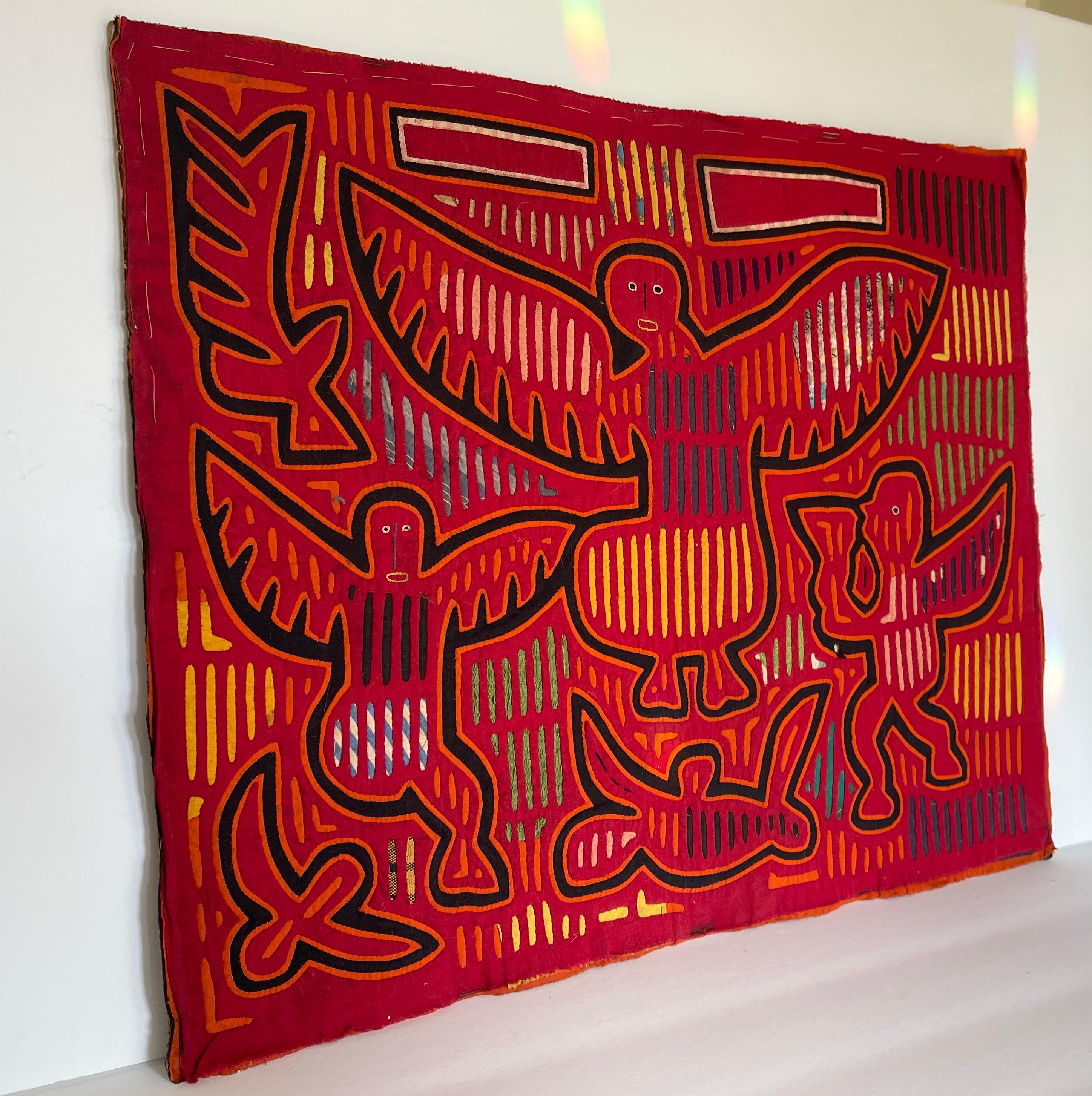 Mid-century Kuna native Mola cotton applique tapestry depicting angels, one holding a chalice.
Mola, a Kuna word, has several meanings: fabric or cloth, shirt or upper garment for men or women, brightly decorated women's blouses, or colorful layers