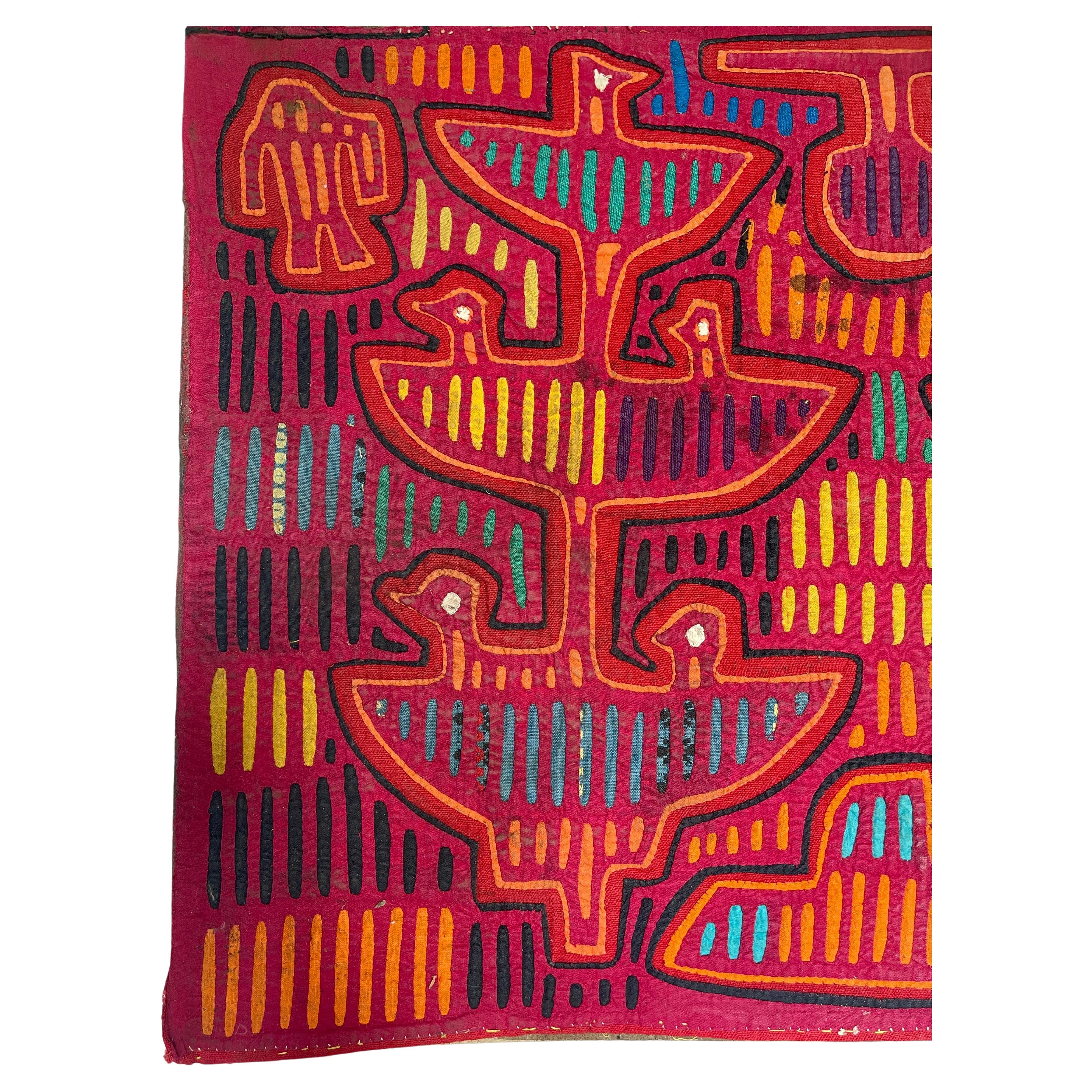 Vintage 1960's Kuna Mola, a traditional multi layered cotton applique tapestry hand sewn by Central American Kuna native women. Mounted on cardboard, for ease of framing, as found, 
The traditional designs often depict their surroundings, families,