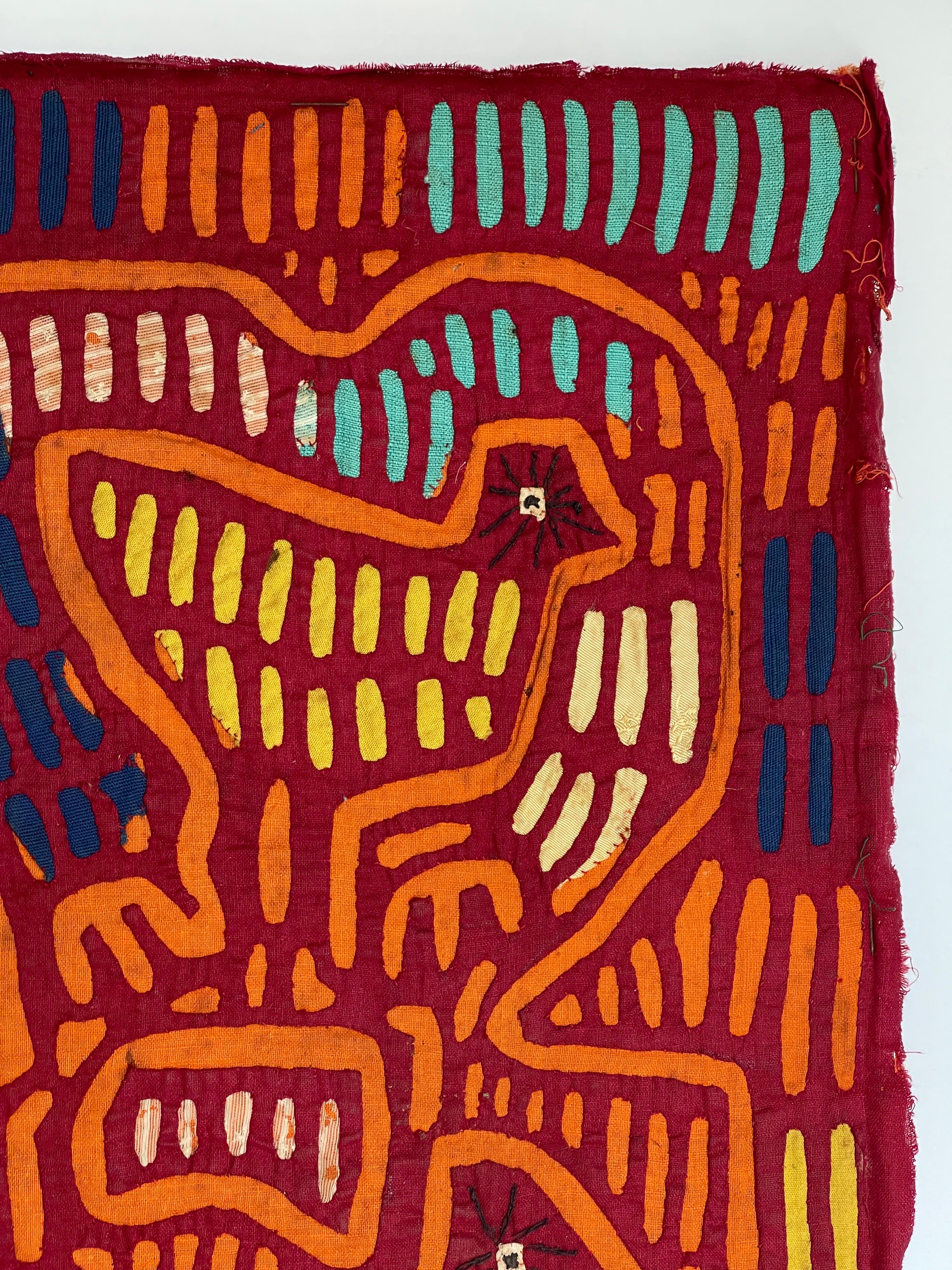 Mola, a Kuna word, has several meanings: fabric or cloth, shirt or upper garment for men or women, brightly decorated women's blouses, or colorful layers of fabric, cut and hand-sewn into designs for fronts and backs of Kuna women´s blouses. Kuna