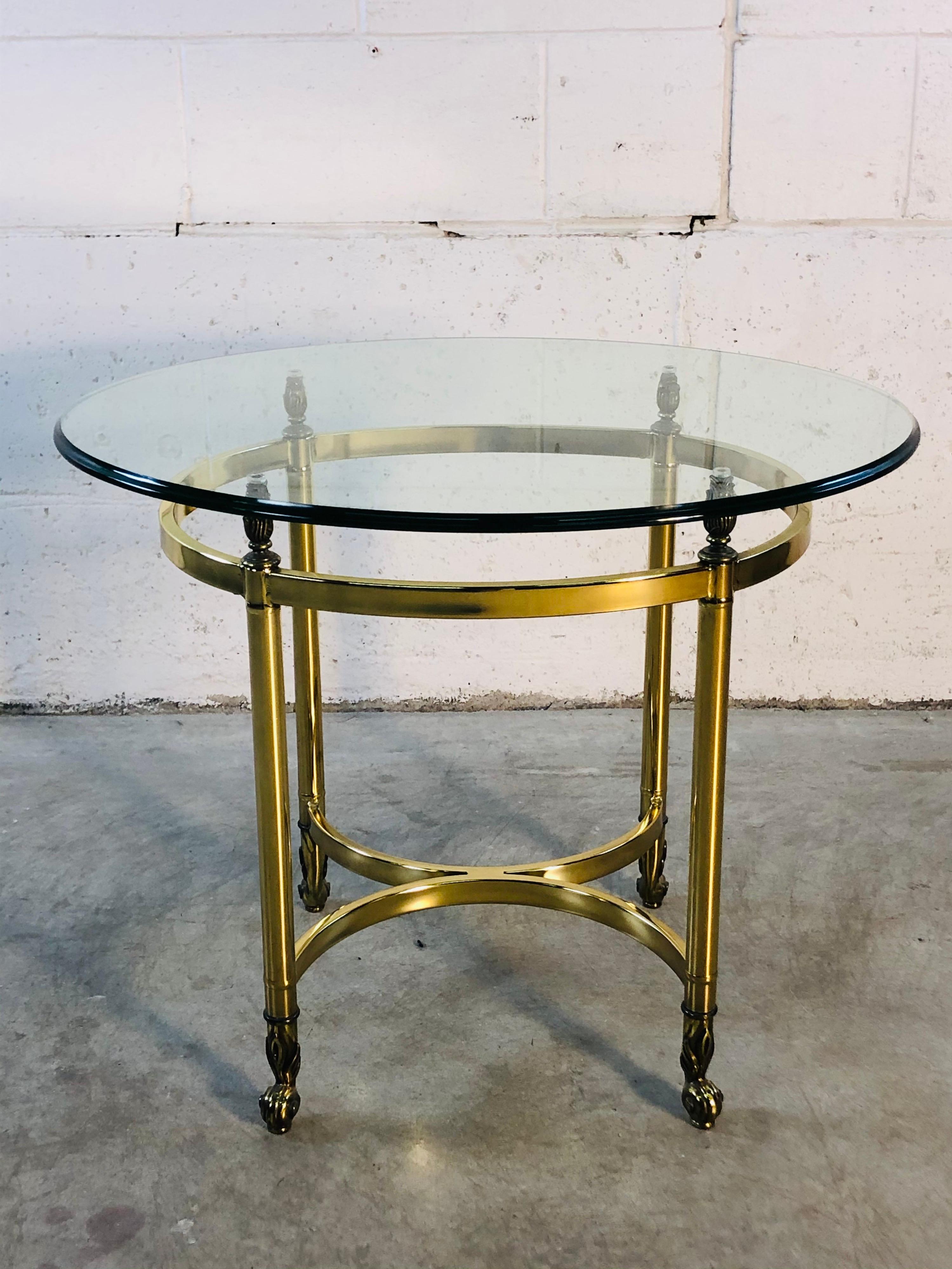 Vintage 1960s LaBarge oval brass and glass top side table with scroll accented feet. Glass top is beveled and in excellent condition. No marks.