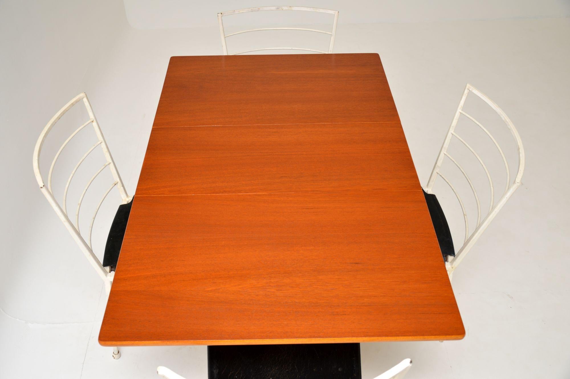 A rare, stylish and very practical dining set by Ladderax, this dates from the 1960s. This consists of a fantastic gate leg dining table and four matching dining chairs. The table has a teak top, which has been stripped and re-polished to
