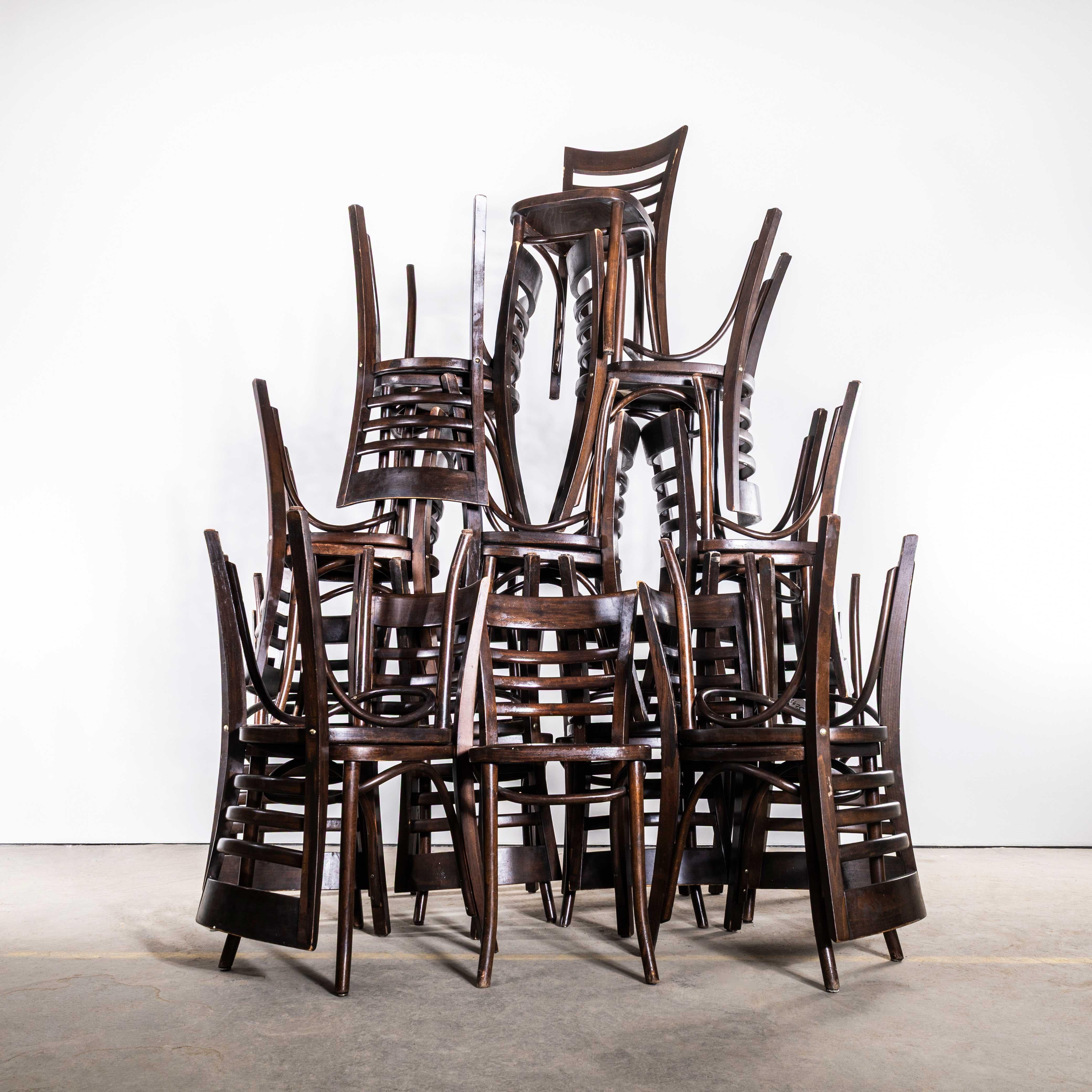 1960’s Ladderback Dark Oak Bentwood Dining Chairs – Large Quantity Available. 

Good quality classic bentwood chairs with a typical 60’s deep dark oak colour and later ladder back design. The chairs were made in Eastern Europe using solid steam bent