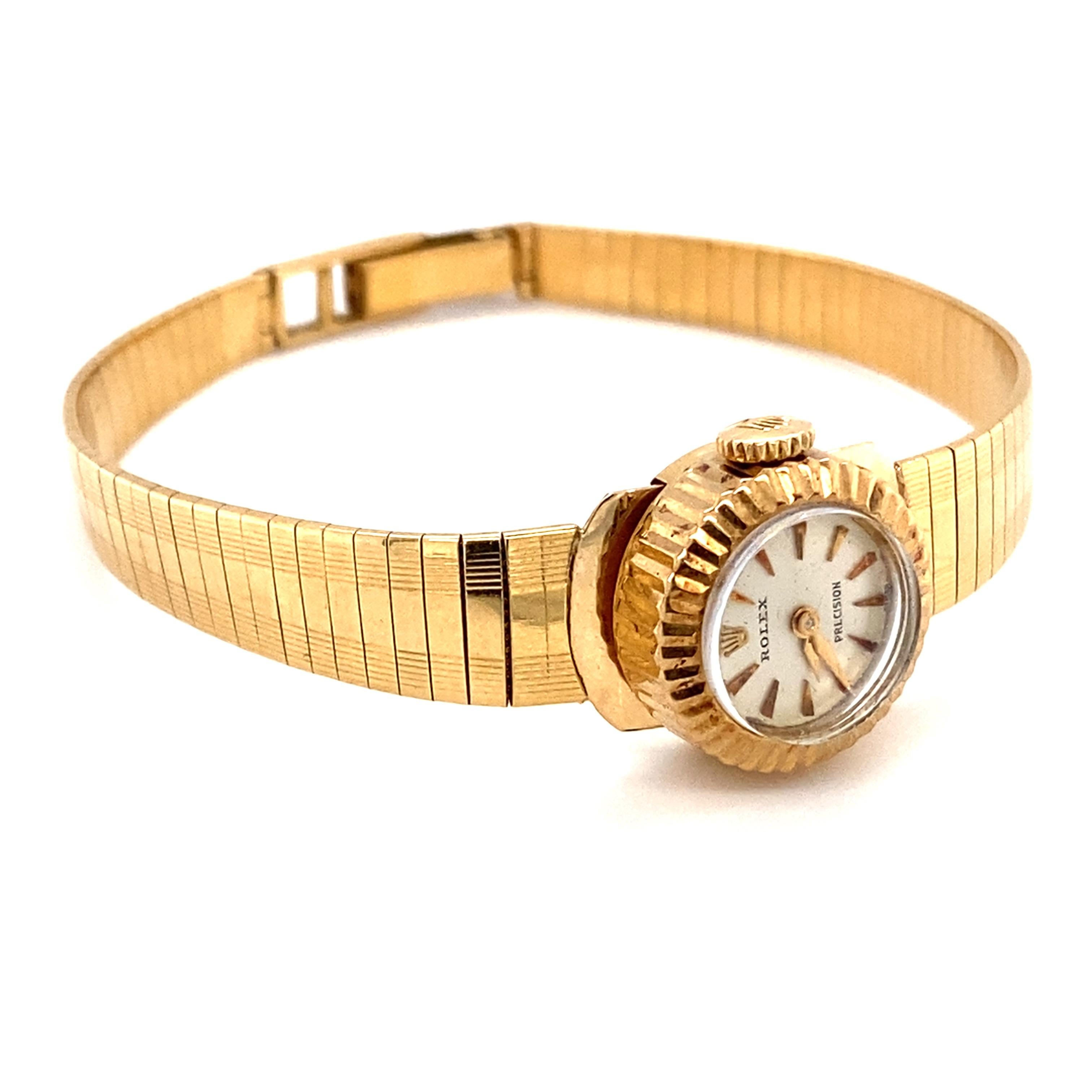 Item Details:
Metal type: 18 Karat Yellow Gold
Weight: 25.5 grams
Measures: 7 inch length 

Item Features:
Made in the 1960s
Decorative and aesthetically pleasing Retro 18 karat yellow gold textured band, fits 7 inch length. The band has a security