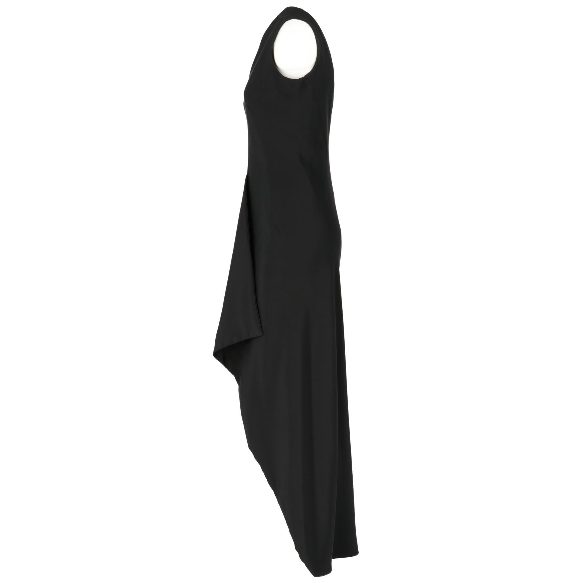 Long sleeveless Lady Florence dress in black silk, fancy design on the front, front open slit, the back part is long to the feet, fitted bust and lightly flared skirt, front and back V neckline and interior lined.
Years: 60s

Made in Italy -