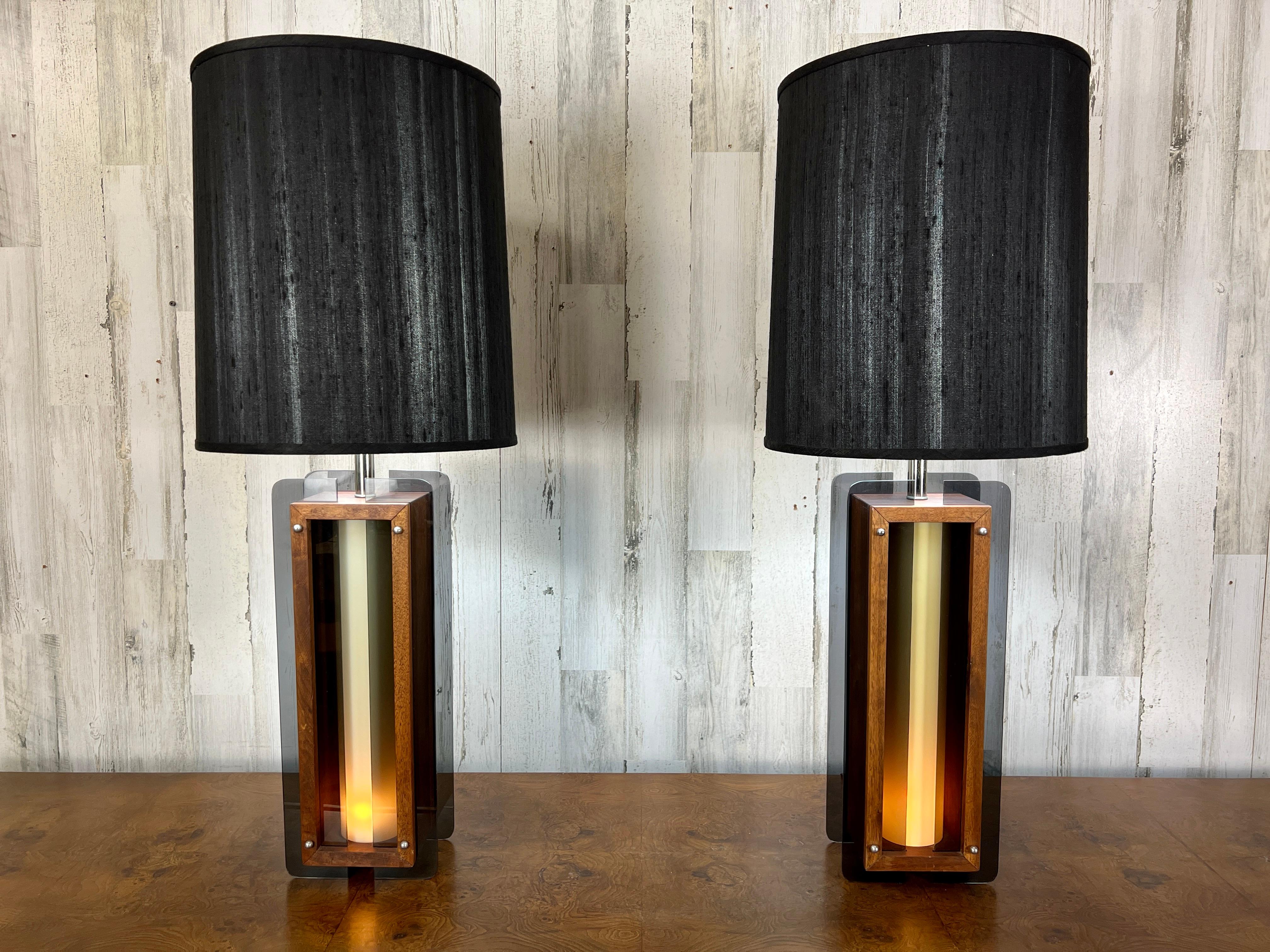 Pair of midcentury table lamps with night light in the base for mood lighting.